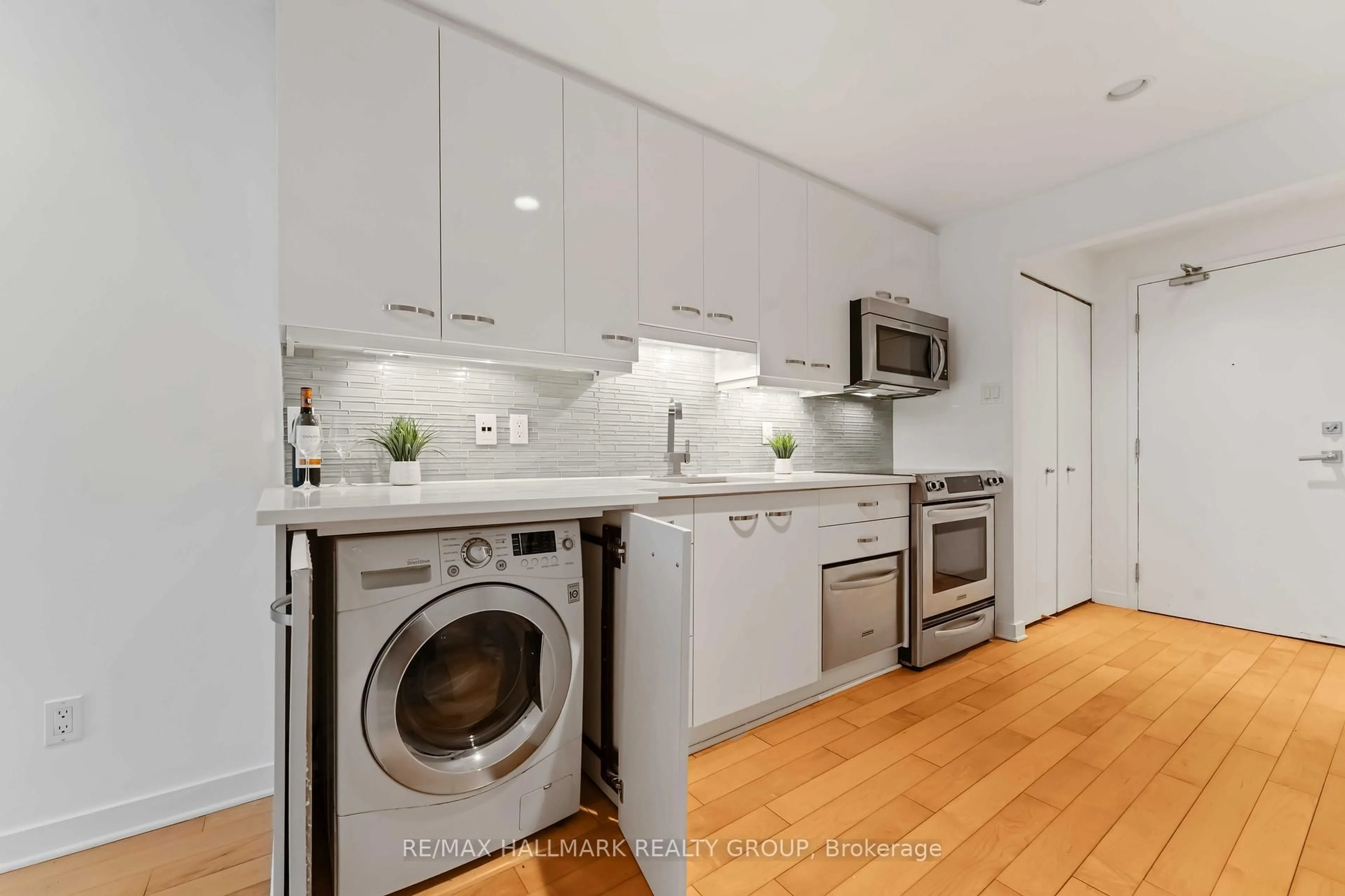 Kitchen with laundary machines, unknown for 202 St Patrick St #15, Ottawa Ontario K1N 5K3