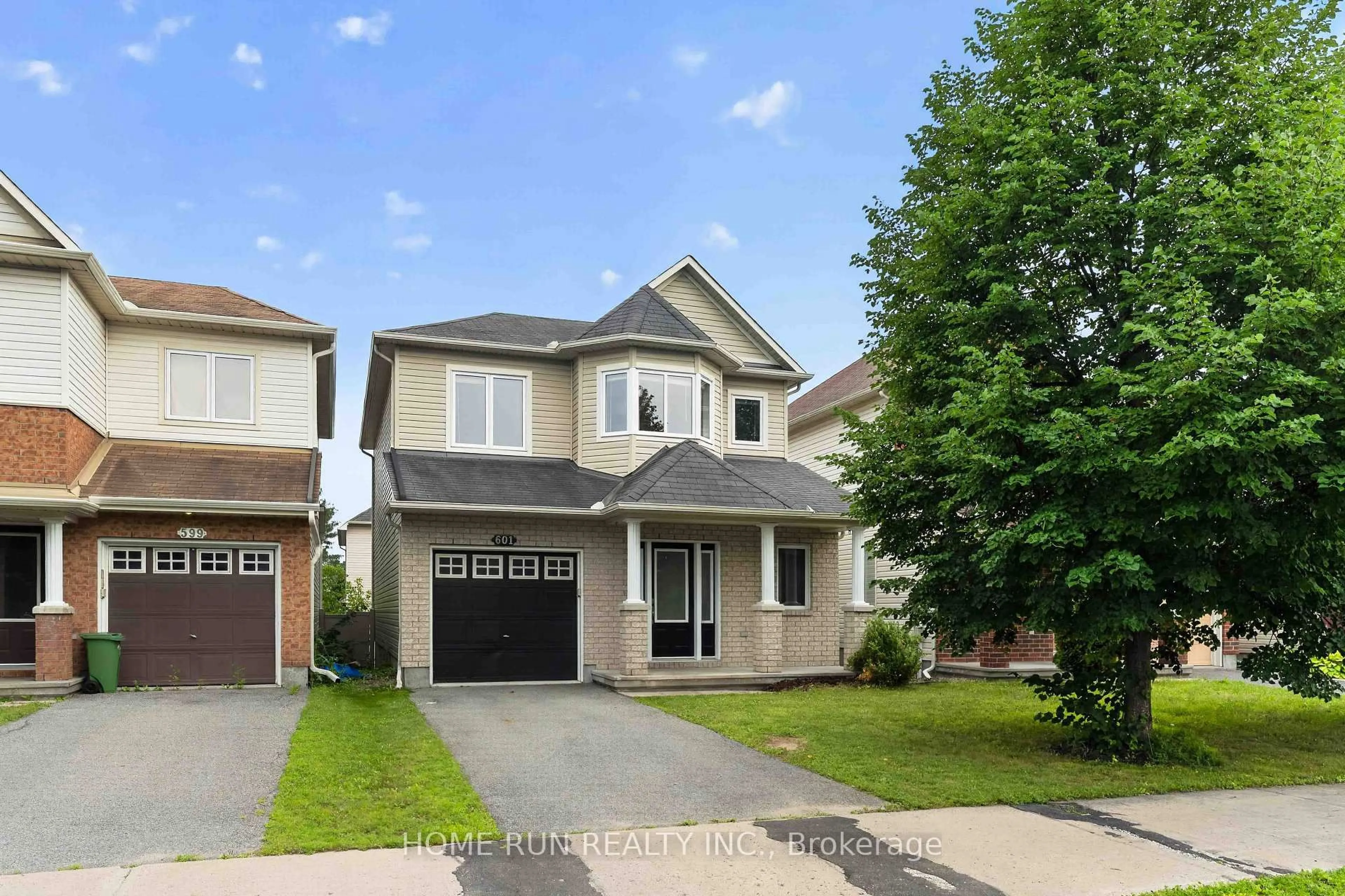 Home with vinyl exterior material, street for 601 Paul Metivier Dr, Ottawa Ontario K2J 0X9