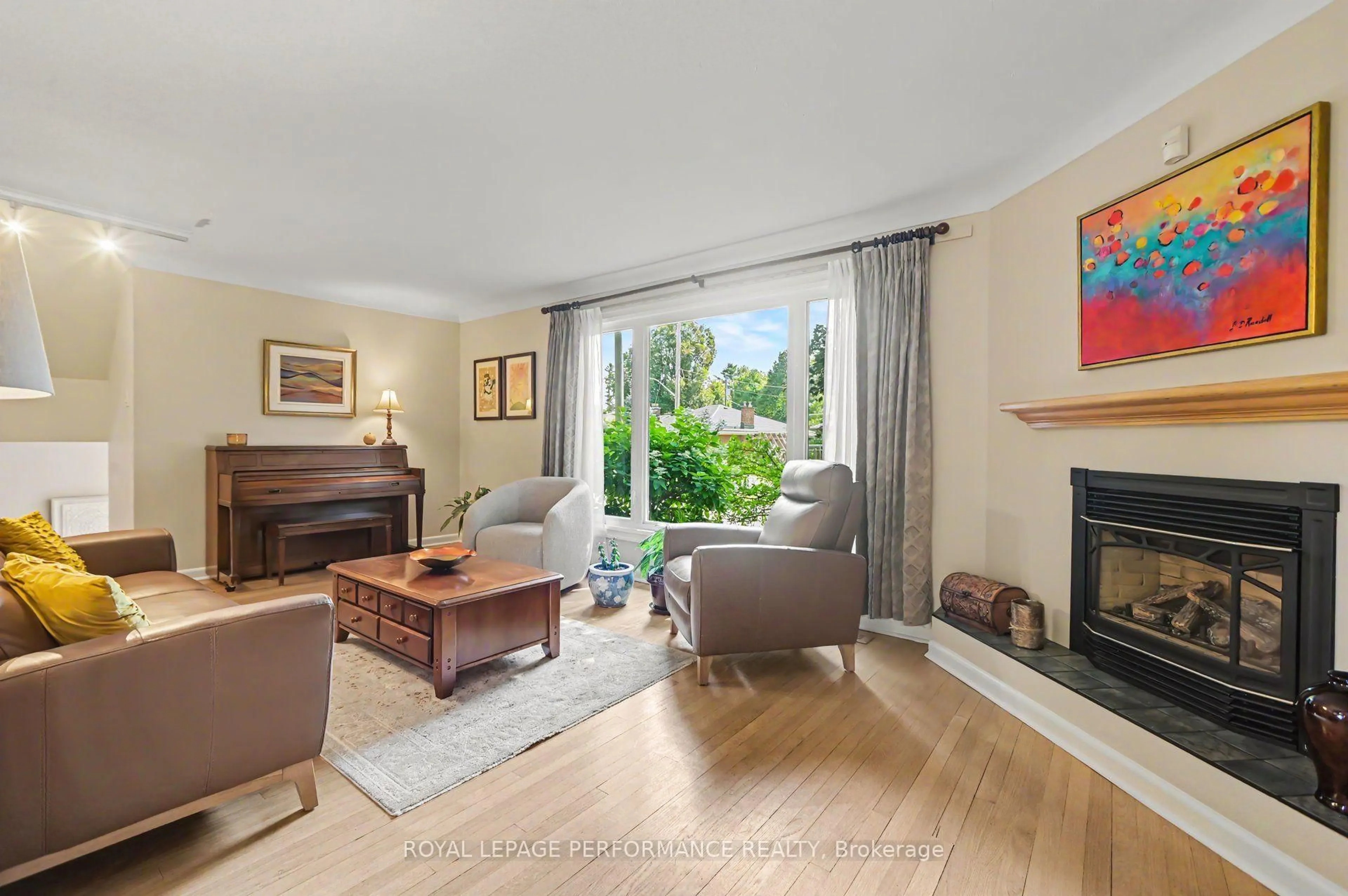 Living room with furniture, wood/laminate floor for 1208 Cline Cres, Ottawa Ontario K2C 2P2