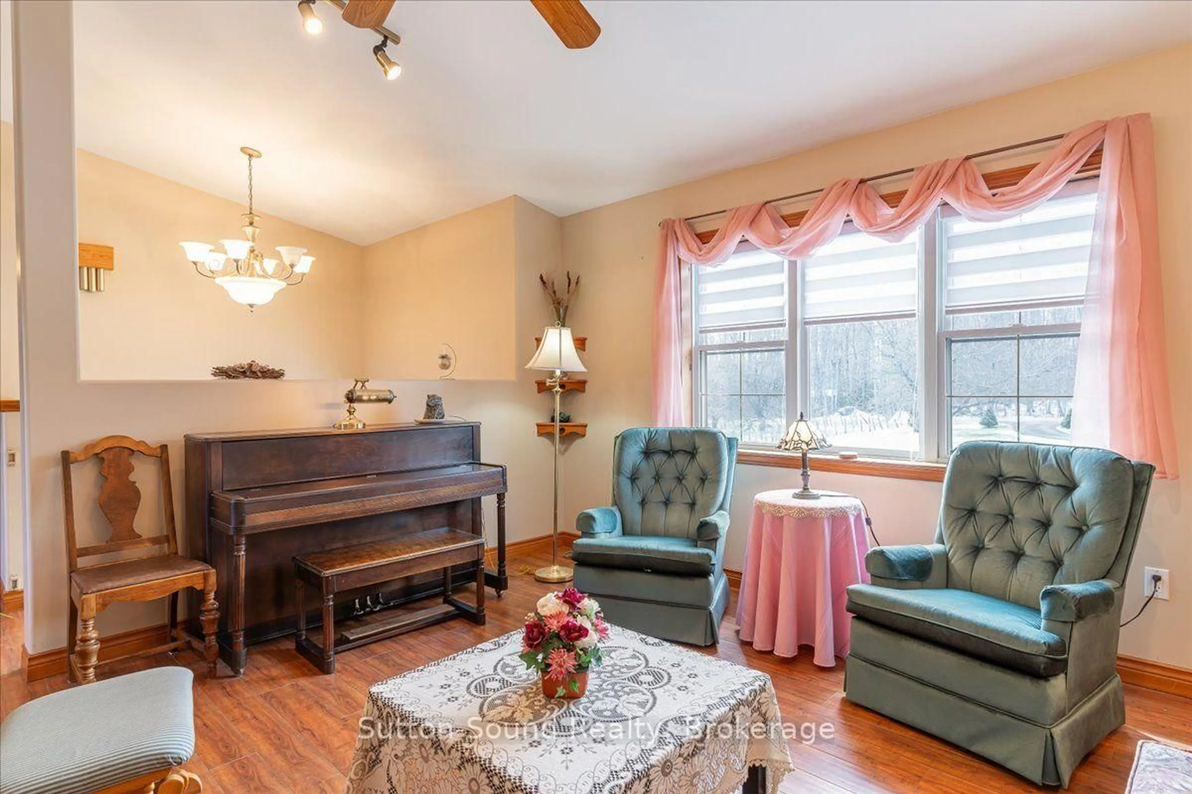 Living room with furniture, wood/laminate floor for 442513 21 Concession, Georgian Bluffs Ontario N0H 2T0