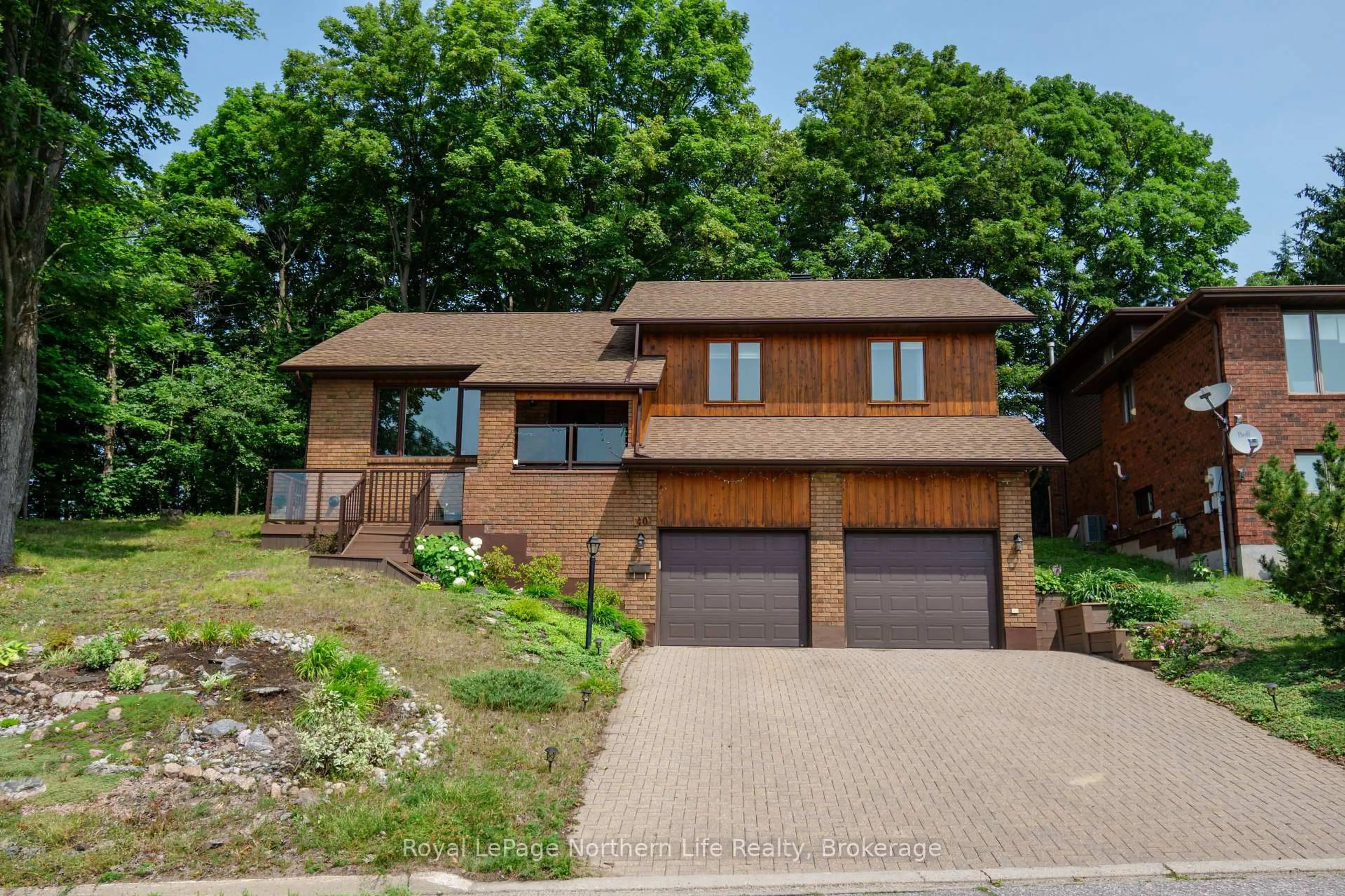 Home with brick exterior material, street for 40 Ellendale Dr, North Bay Ontario P1B 8X6