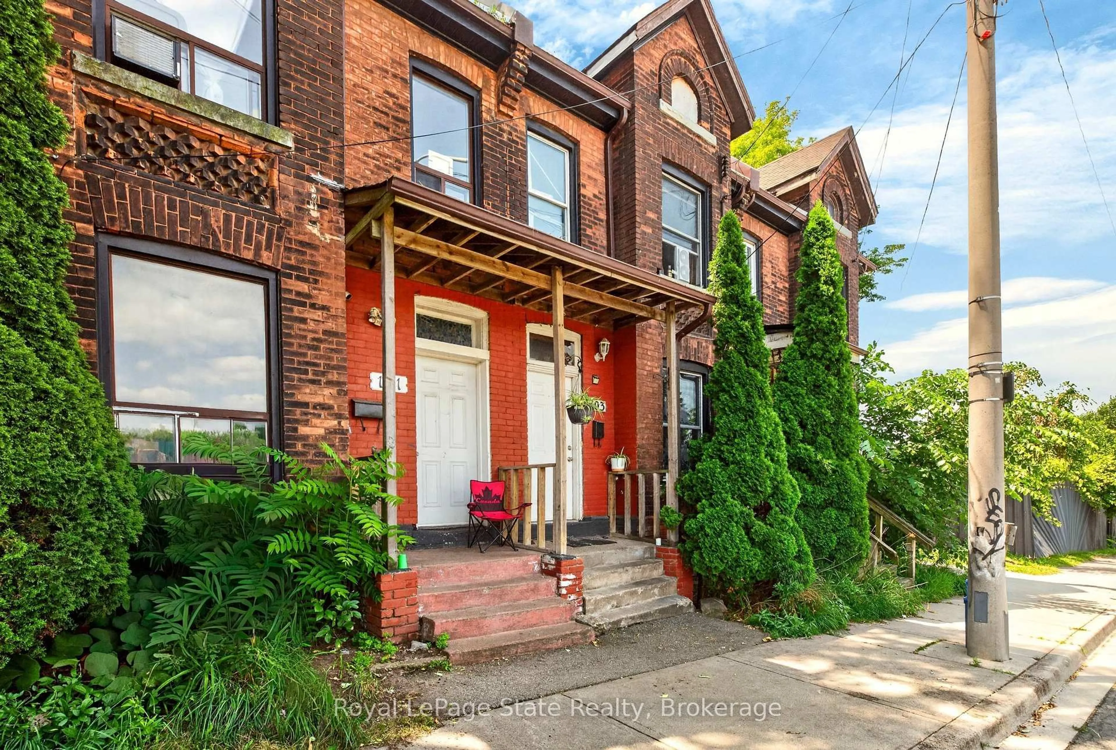Home with brick exterior material, street for 103 Stuart St, Hamilton Ontario L8L 1B6