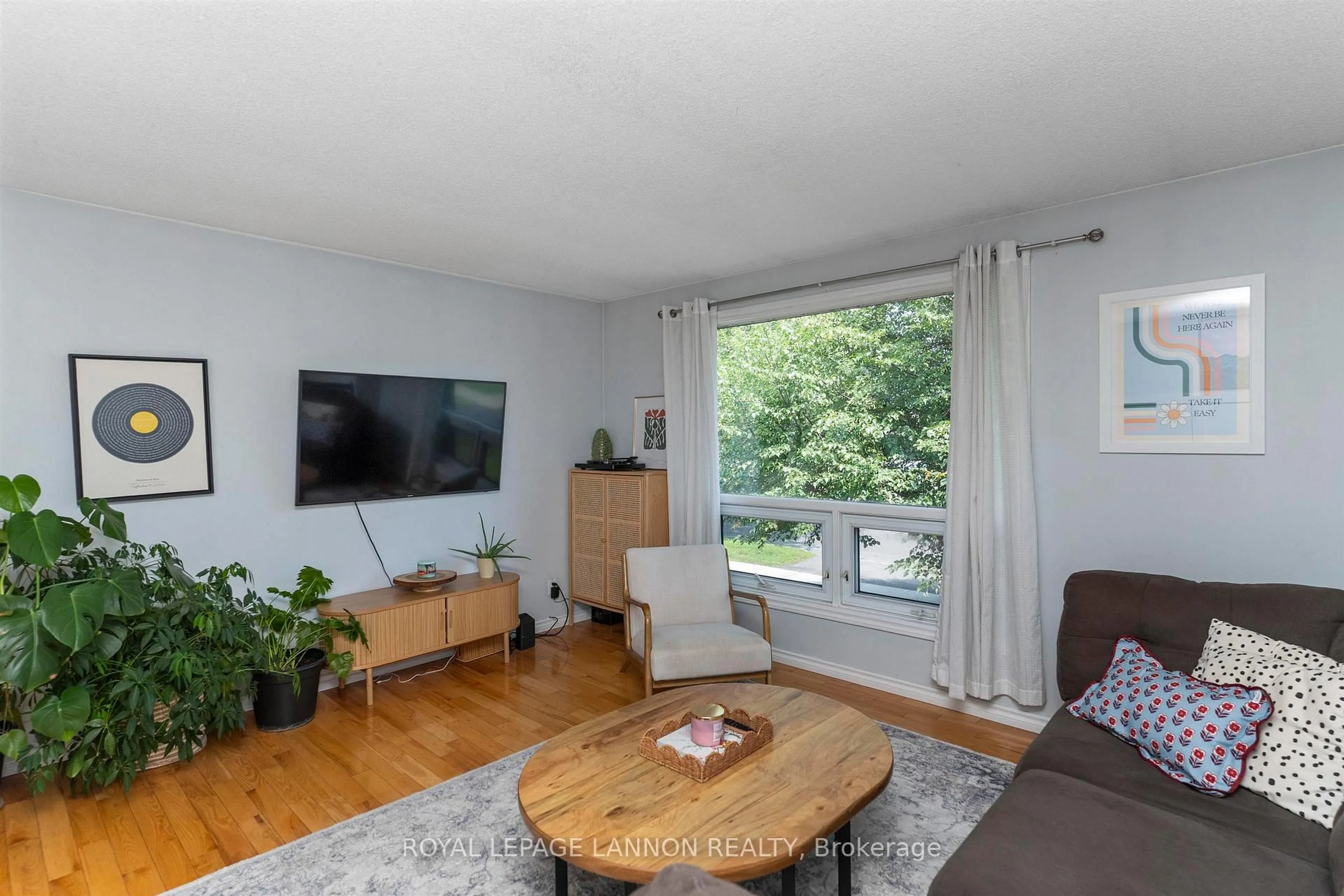 Living room with furniture, wood/laminate floor for 145 Conestoga St, Thunder Bay Ontario P7C 5S9