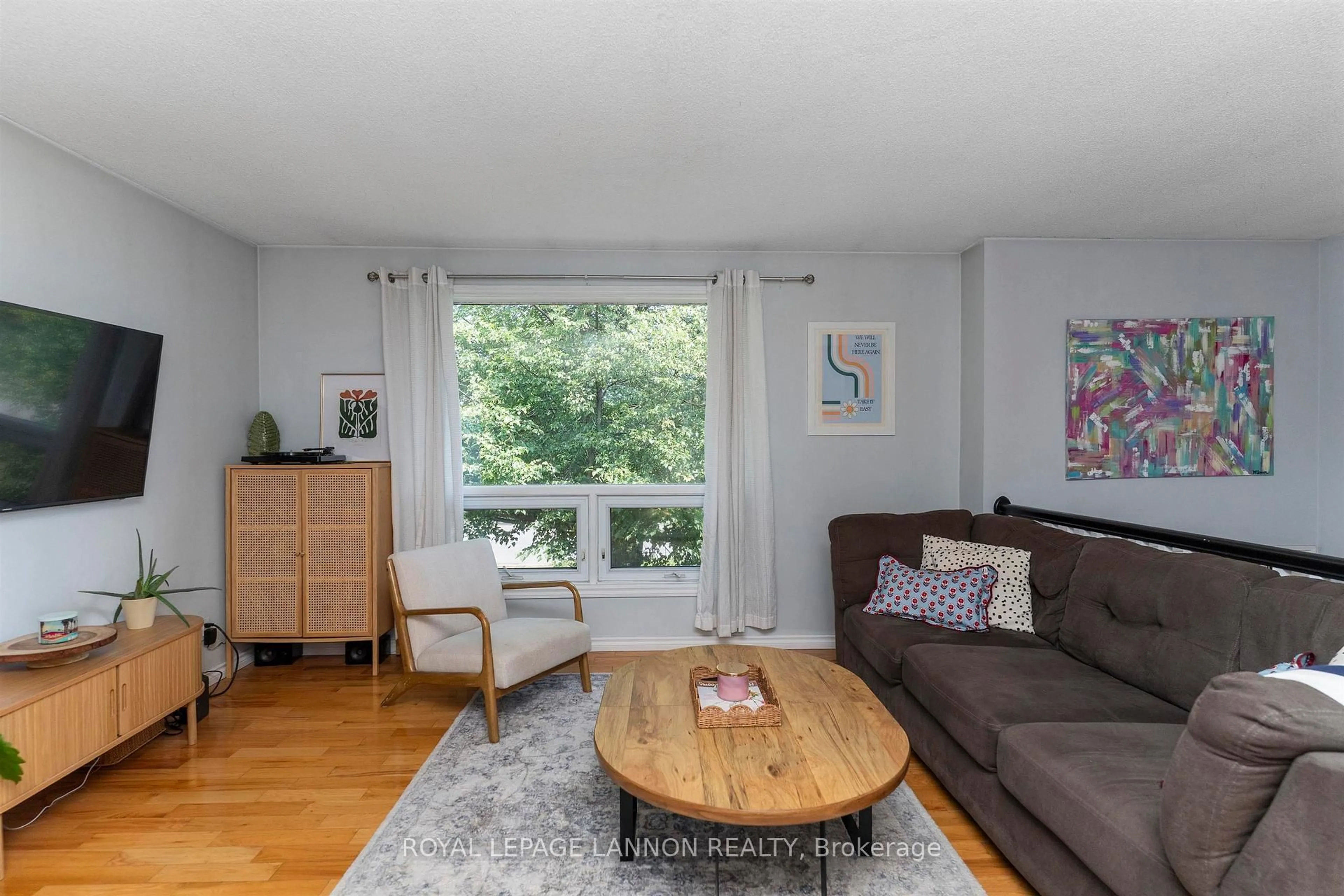 Living room with furniture, wood/laminate floor for 145 Conestoga St, Thunder Bay Ontario P7C 5S9