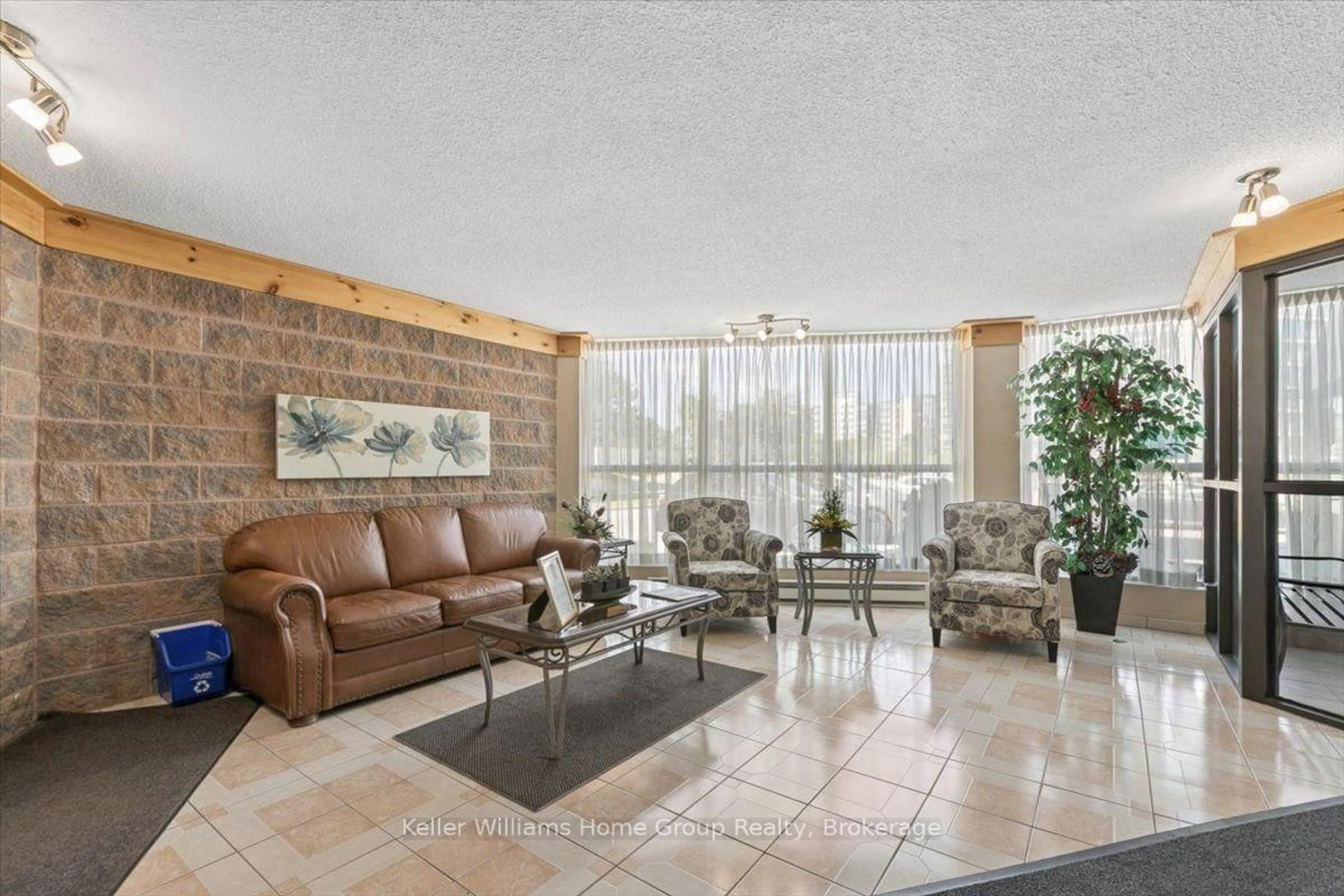 Living room with furniture, ceramic/tile floor for 24 Marilyn Dr #902, Guelph Ontario N1H 8E9