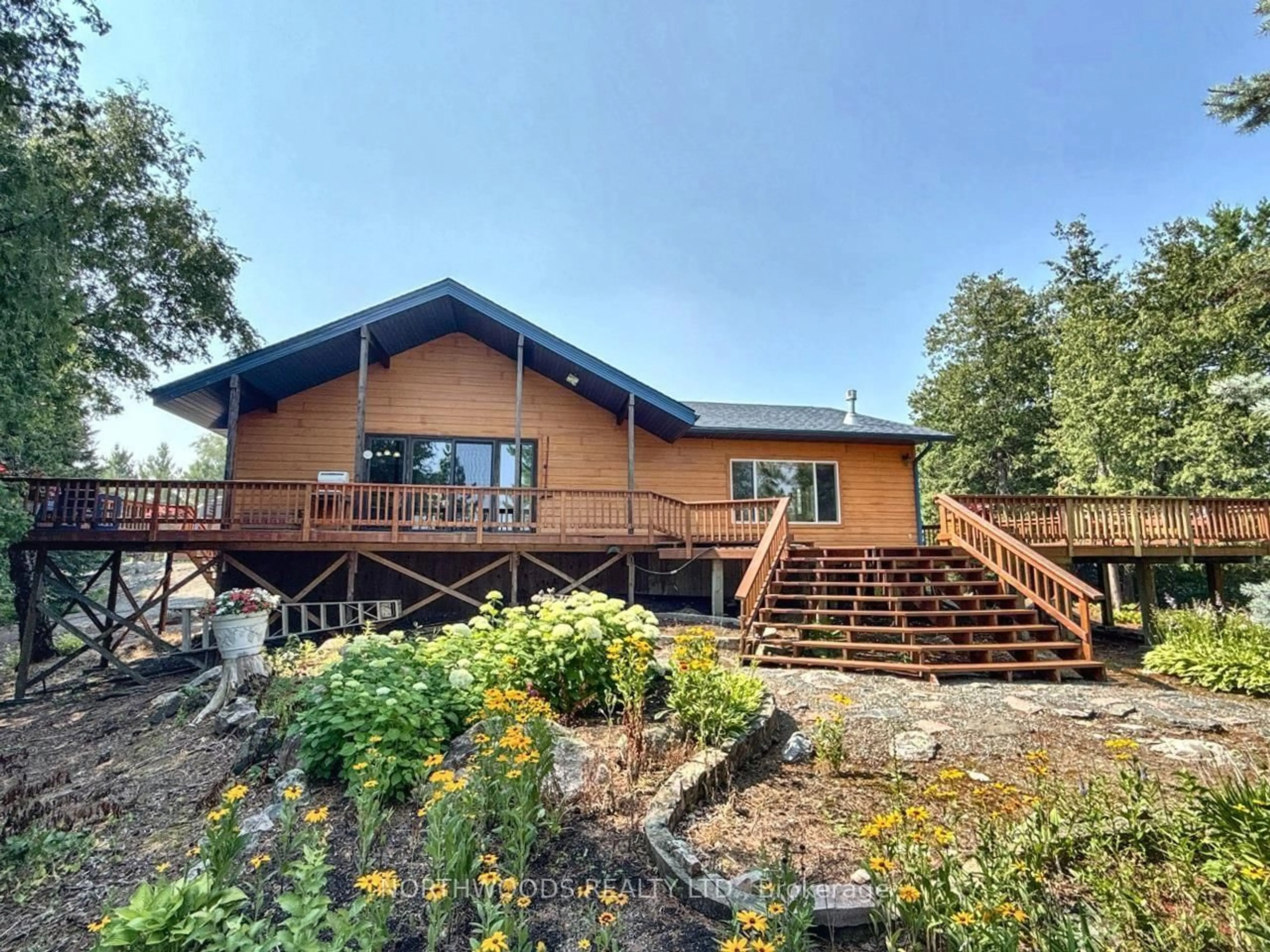 A pic from outside/outdoor area/front of a property/back of a property/a pic from drone, water/lake/river/ocean view for 36 Heronry Lake Road South, Sioux Narrows-Nestor Falls Ontario P0X 1K0