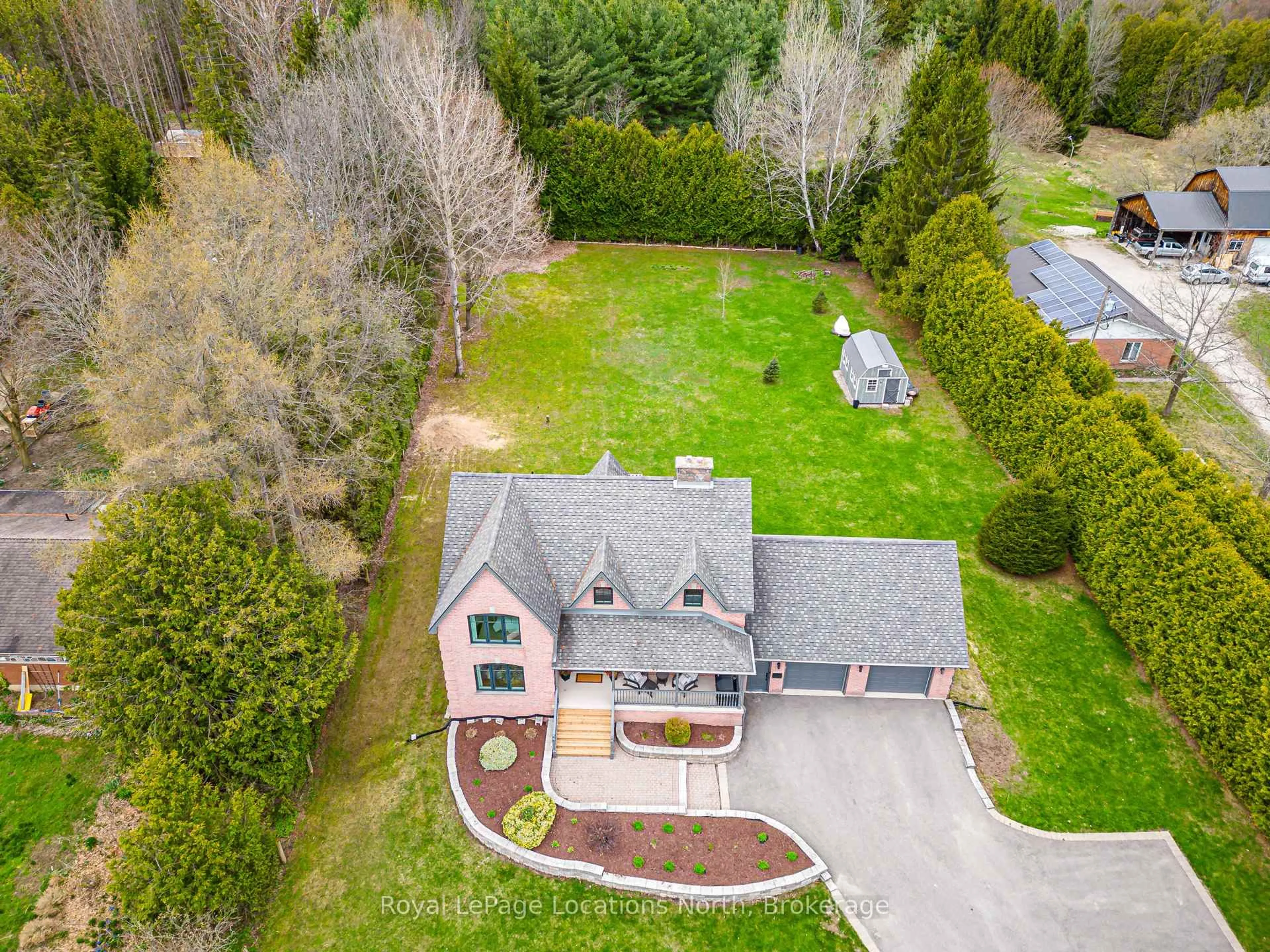 A pic from outside/outdoor area/front of a property/back of a property/a pic from drone, street for 158078 7th Line, Meaford Ontario N4L 1W5