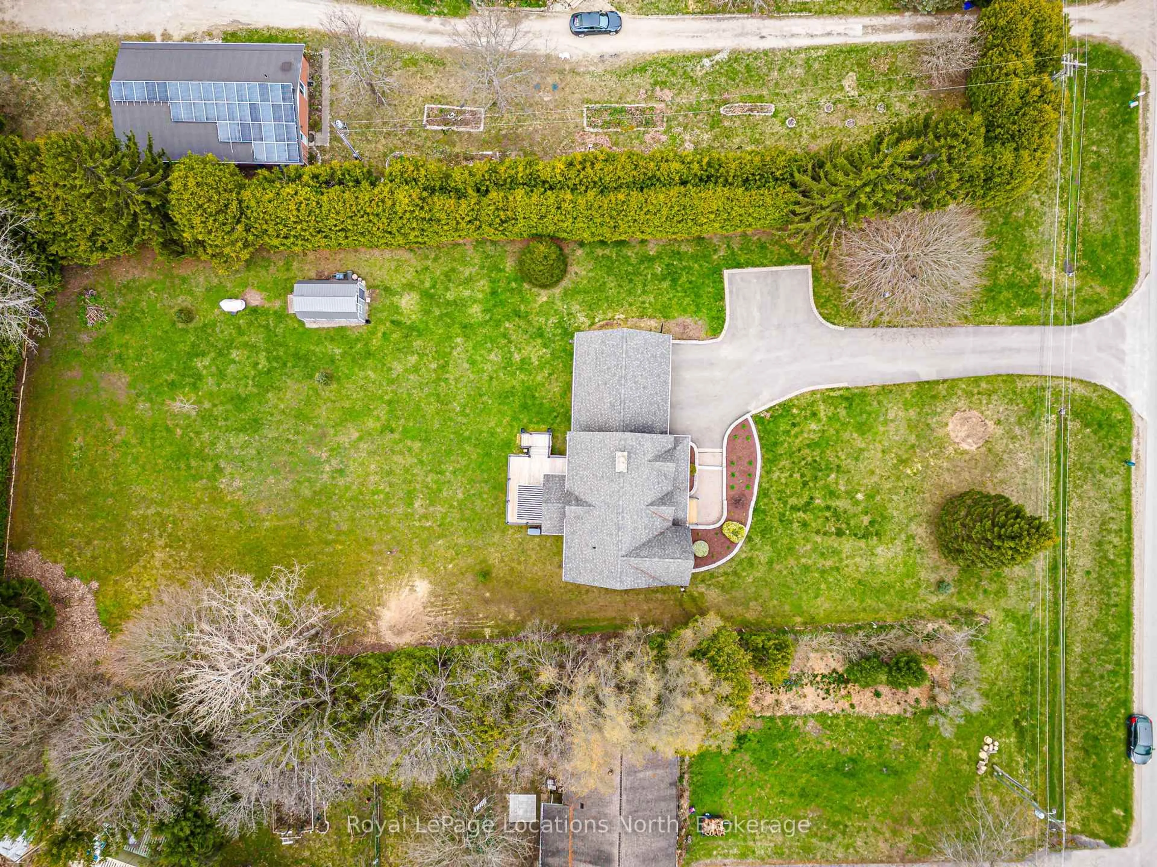 A pic from outside/outdoor area/front of a property/back of a property/a pic from drone, street for 158078 7th Line, Meaford Ontario N4L 1W5