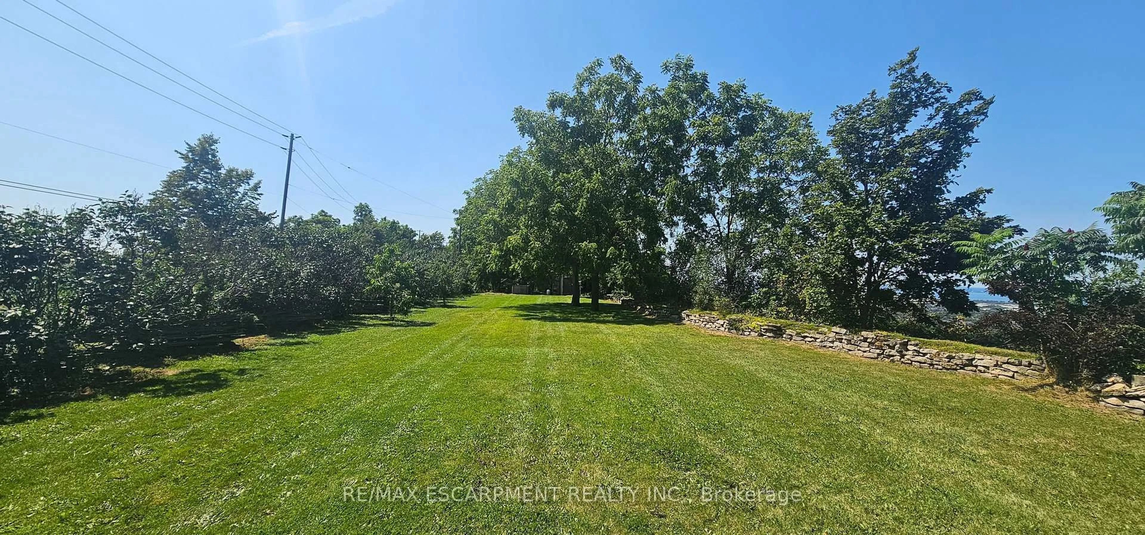 A pic from outside/outdoor area/front of a property/back of a property/a pic from drone, forest/trees view for 665 RIDGE Rd, Hamilton Ontario L8J 2Y2