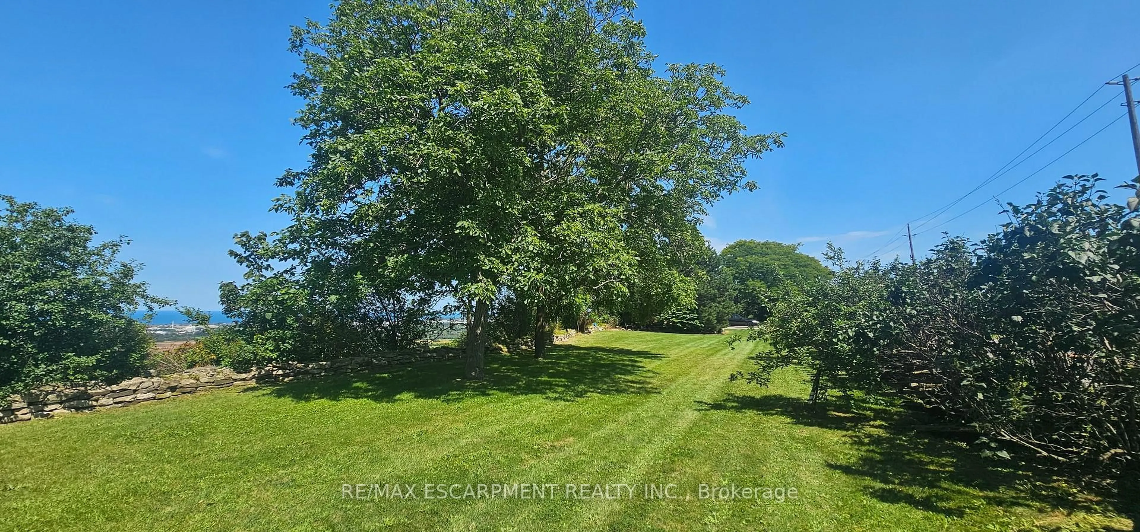 A pic from outside/outdoor area/front of a property/back of a property/a pic from drone, forest/trees view for 665 RIDGE Rd, Hamilton Ontario L8J 2Y2