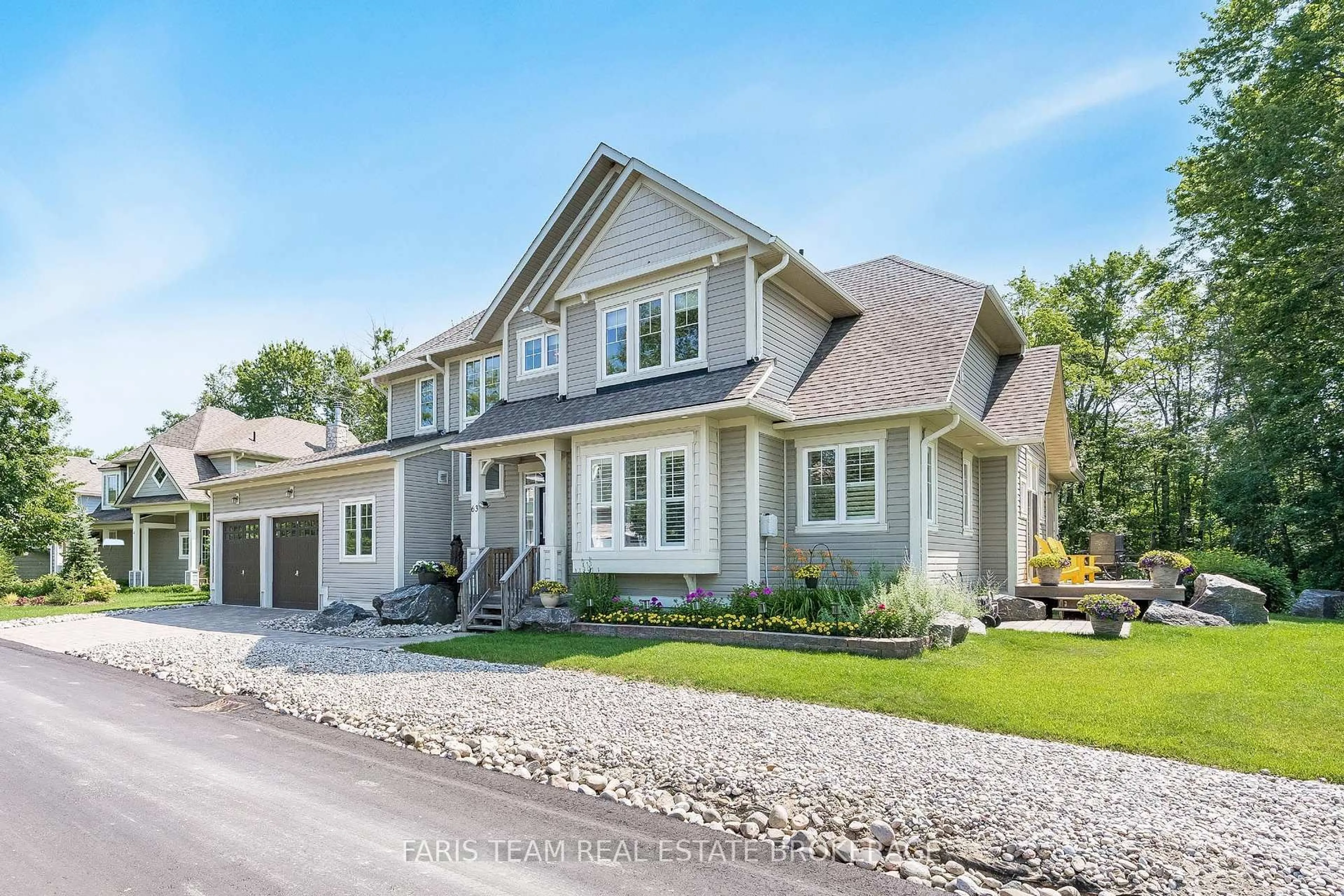 Home with vinyl exterior material, street for 63 Marina Village Dr, Georgian Bay Ontario L0K 1S0