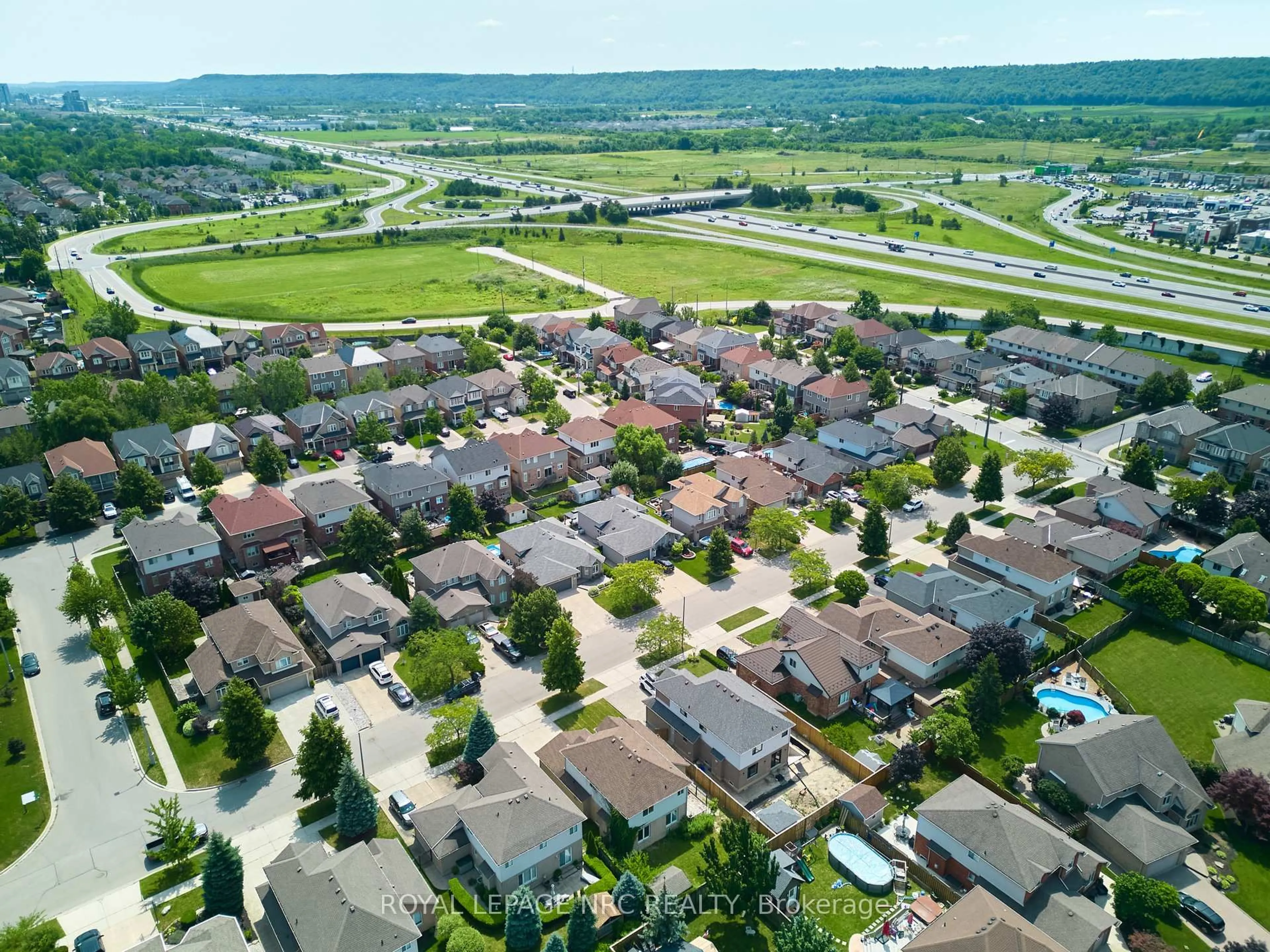 A pic from outside/outdoor area/front of a property/back of a property/a pic from drone, street for 15 Creanona Blvd, Hamilton Ontario L8E 5G2