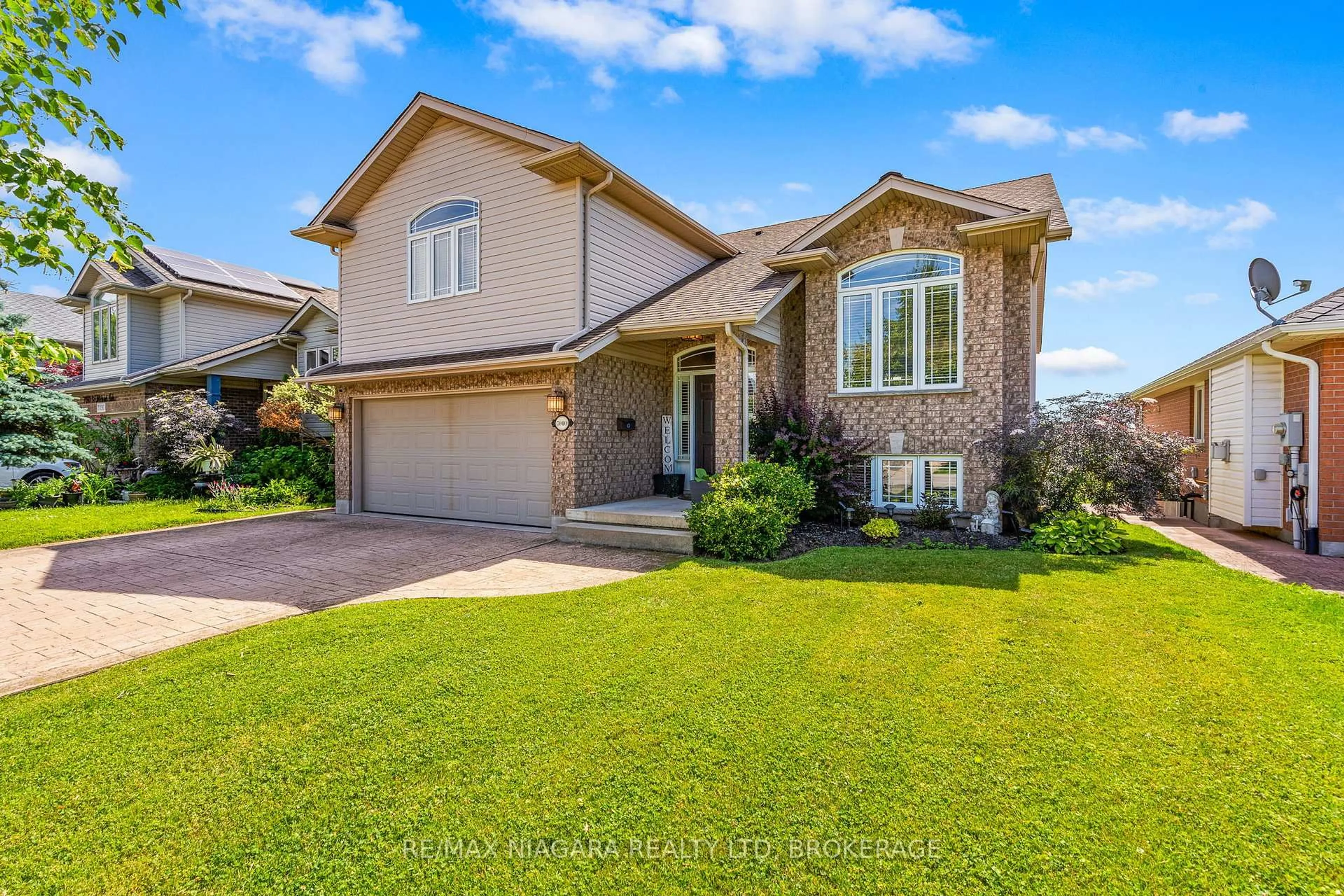 Home with brick exterior material, street for 7040 St Michael Ave, Niagara Falls Ontario L2H 3N9