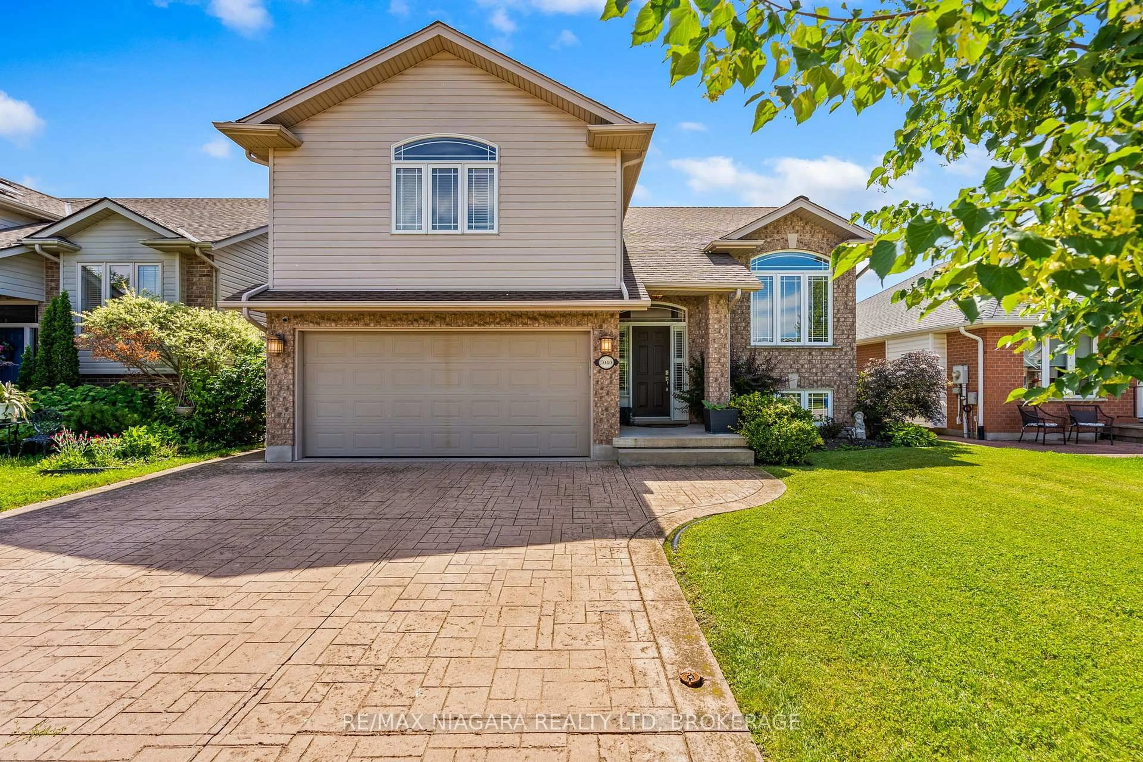 Home with brick exterior material, street for 7040 St Michael Ave, Niagara Falls Ontario L2H 3N9