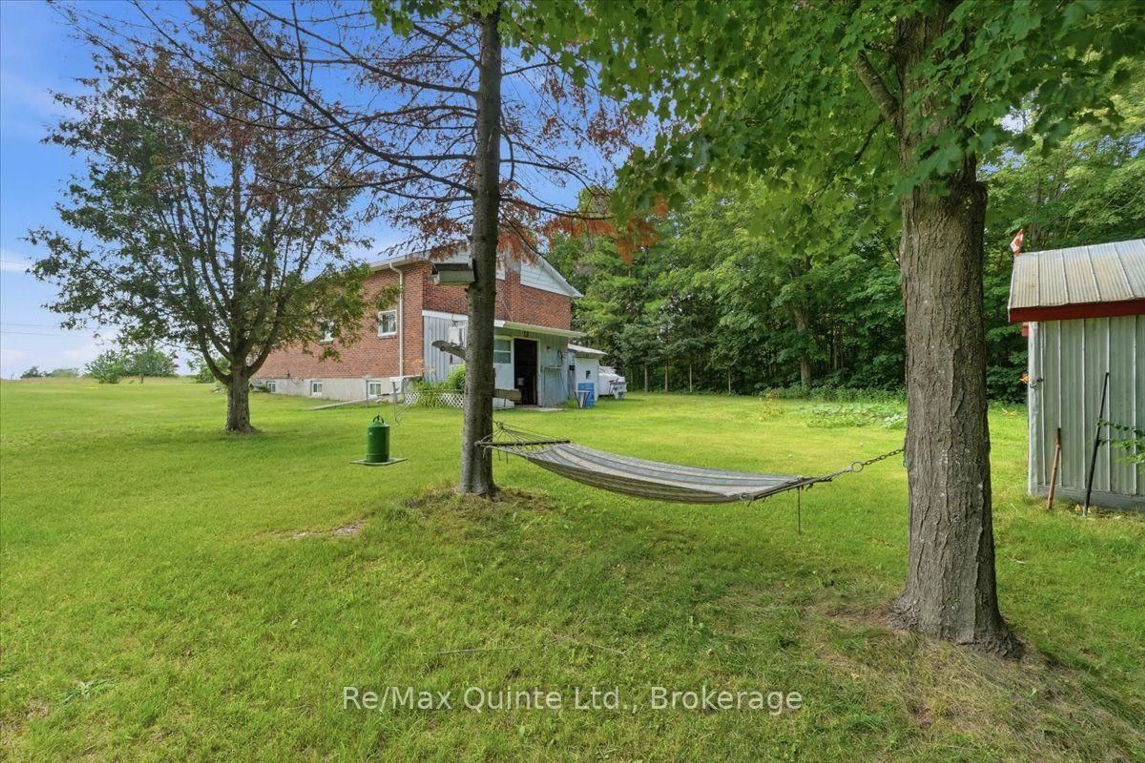 A pic from outside/outdoor area/front of a property/back of a property/a pic from drone, water/lake/river/ocean view for 16492 Highway 62, Madoc Ontario K0K 1Y0