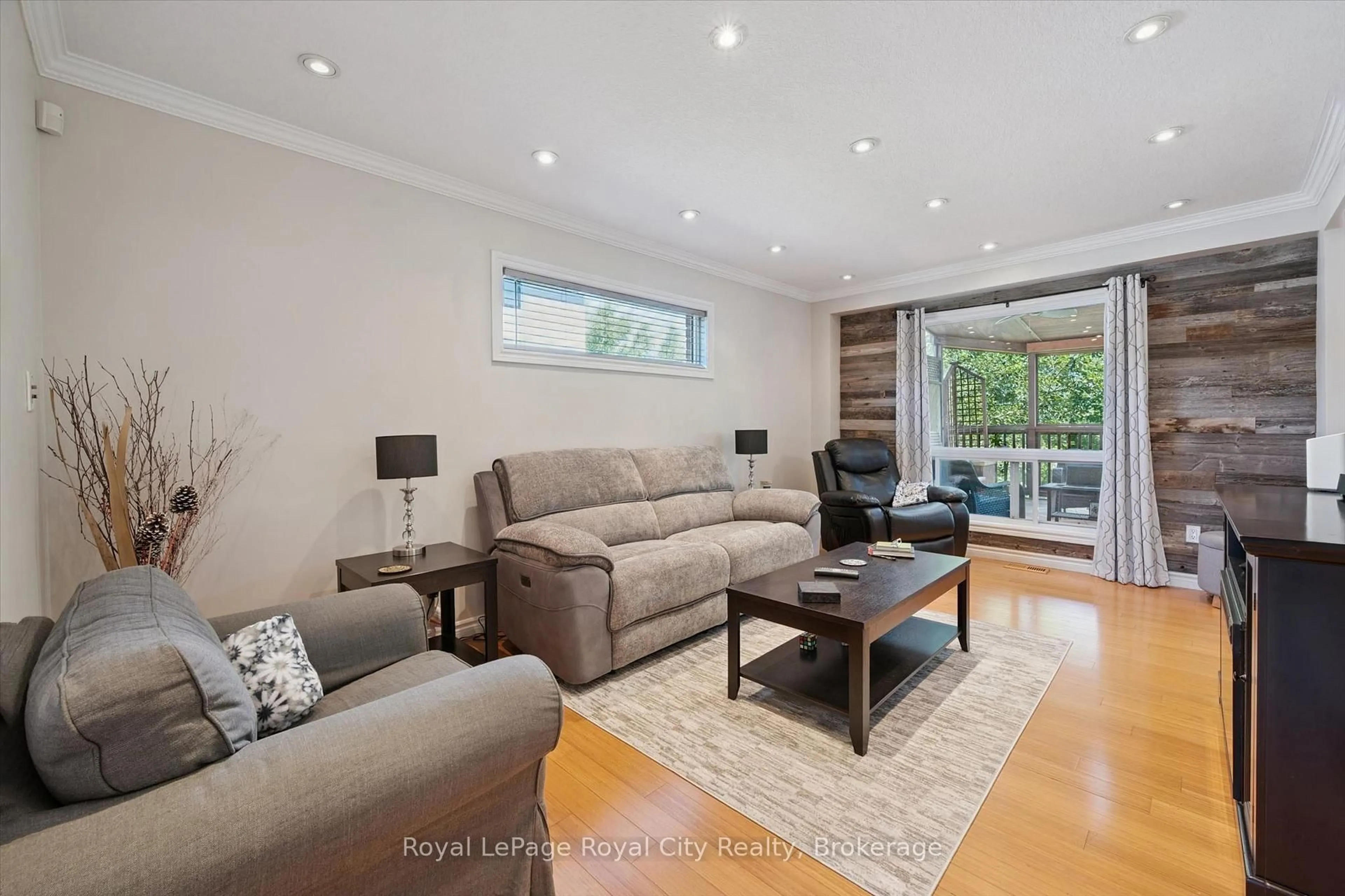 Living room with furniture, wood/laminate floor for 220 Carrington Dr, Guelph Ontario N1G 5K3