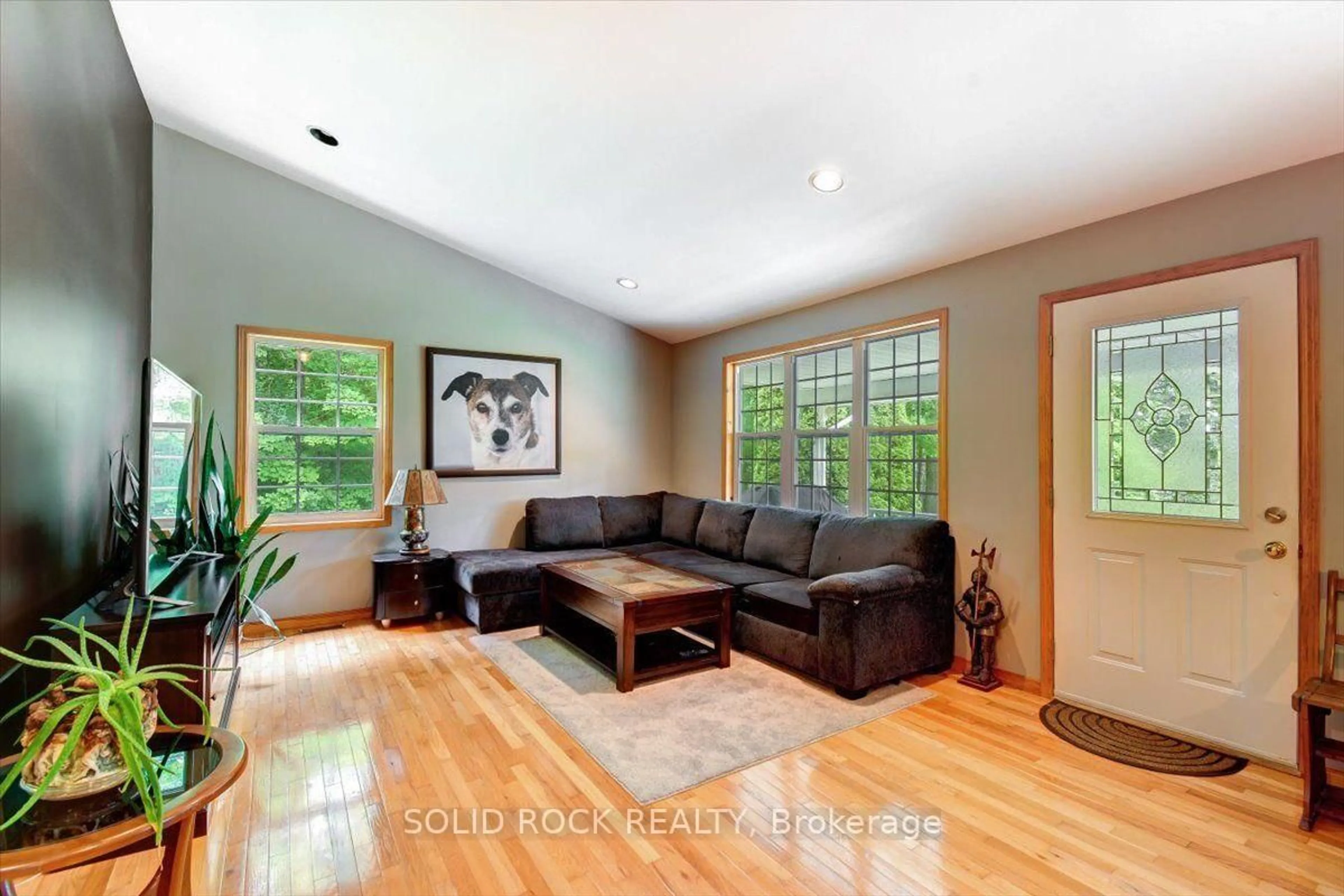 Living room with furniture, wood/laminate floor for 313 Pine Grove Rd, Cramahe Ontario K0K 1M0