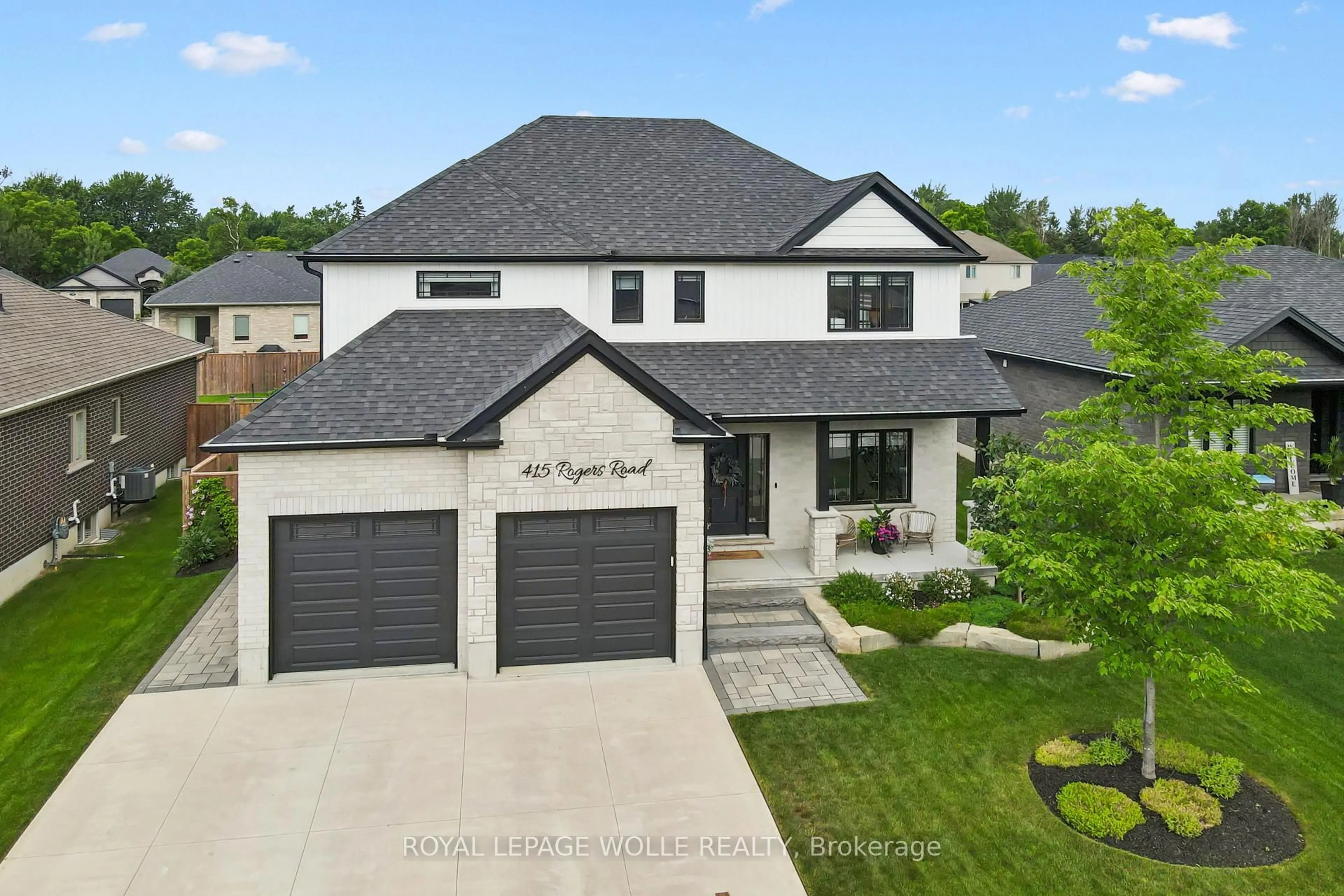 A pic from outside/outdoor area/front of a property/back of a property/a pic from drone, street for 415 Rogers Rd, North Perth Ontario N4W 0H2