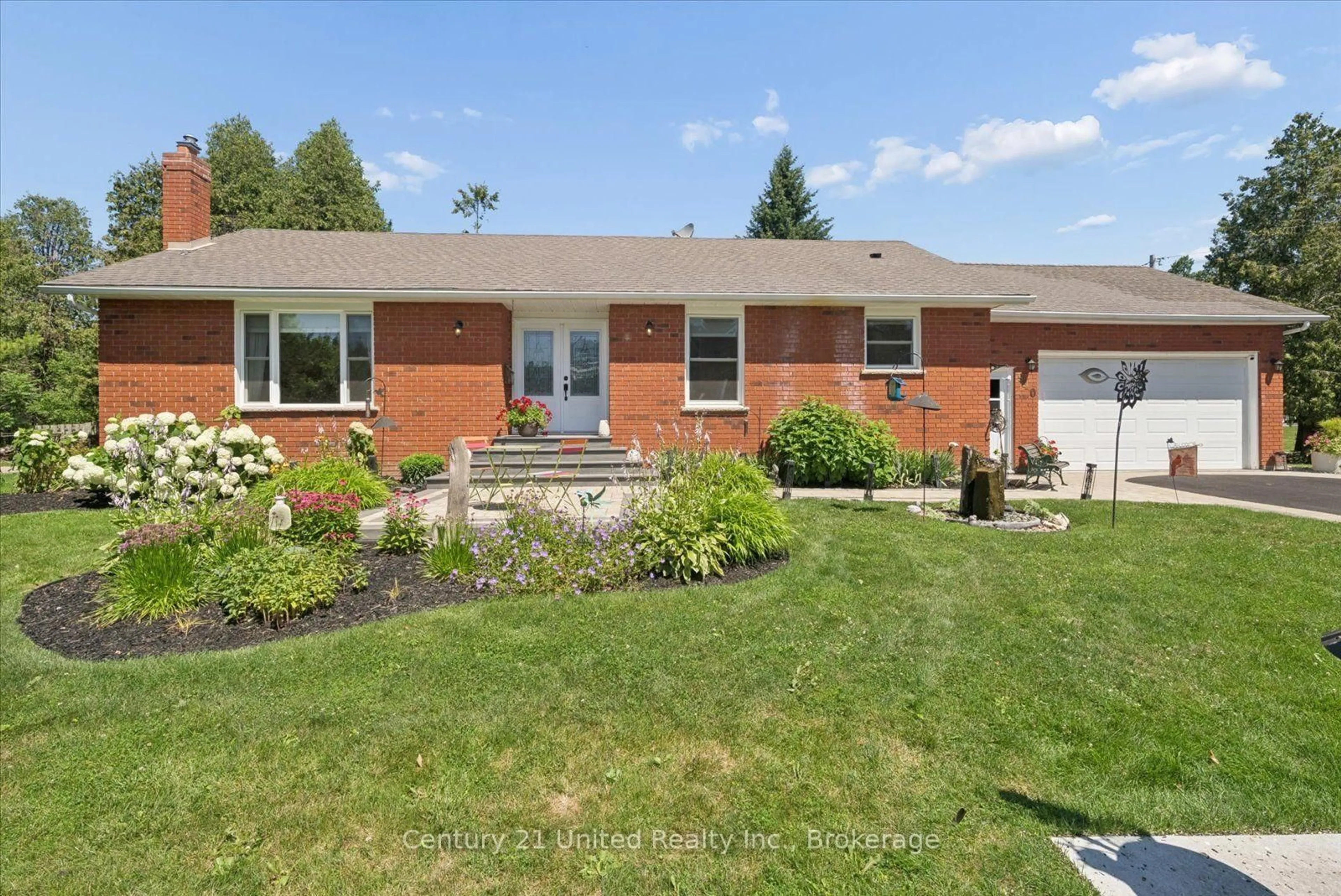 Home with brick exterior material, street for 940 Cavan Wood Dr, Cavan Monaghan Ontario L0A 1C0
