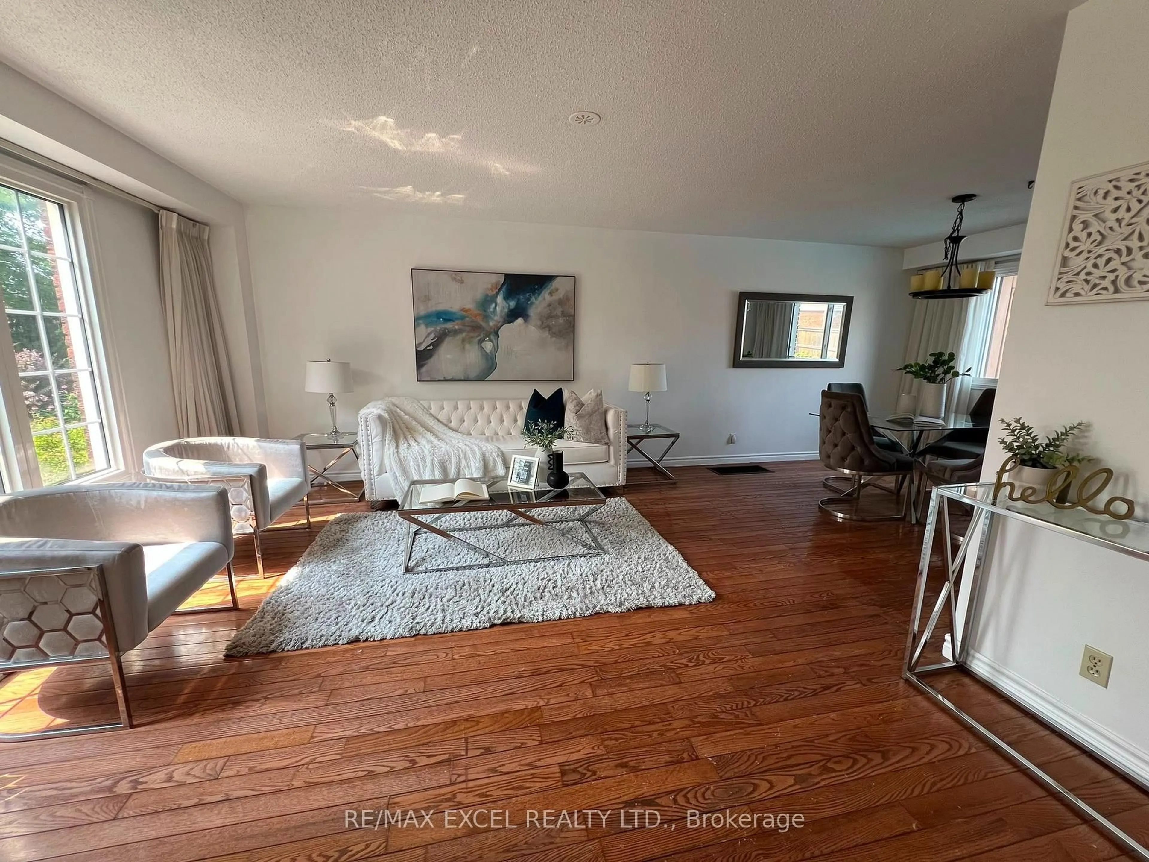 Living room with furniture, wood/laminate floor for 218 Angeline St, Kawartha Lakes Ontario K9V 5E9