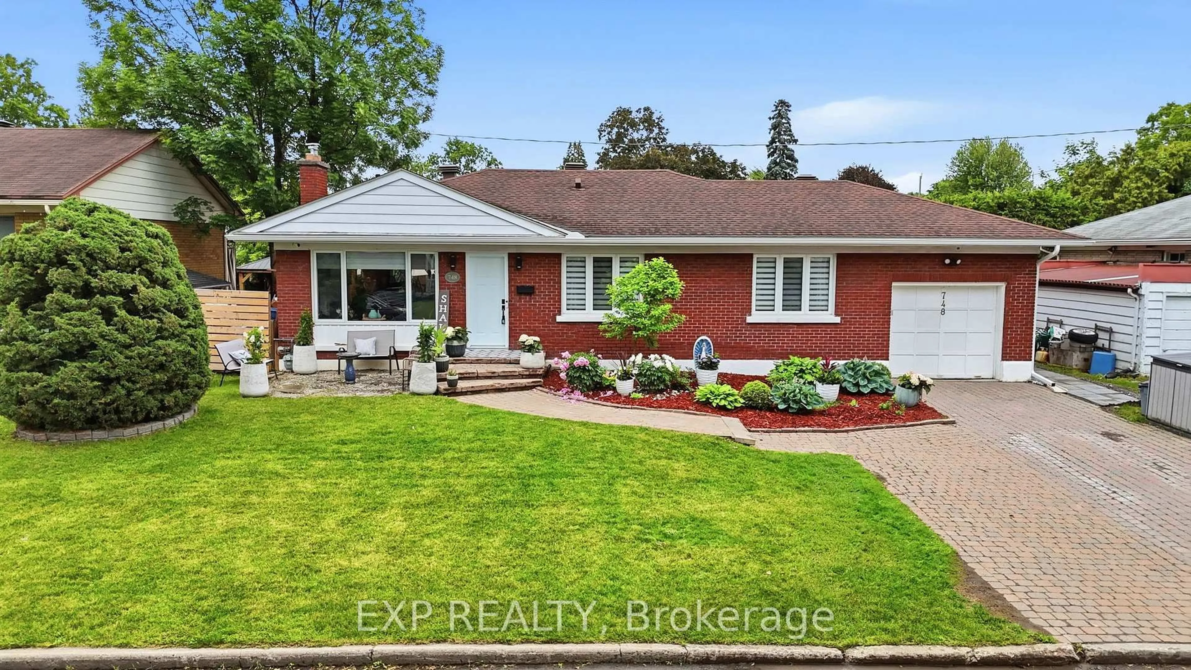 Home with brick exterior material, street for 748 WESTON Dr, Ottawa Ontario K1G 1W2