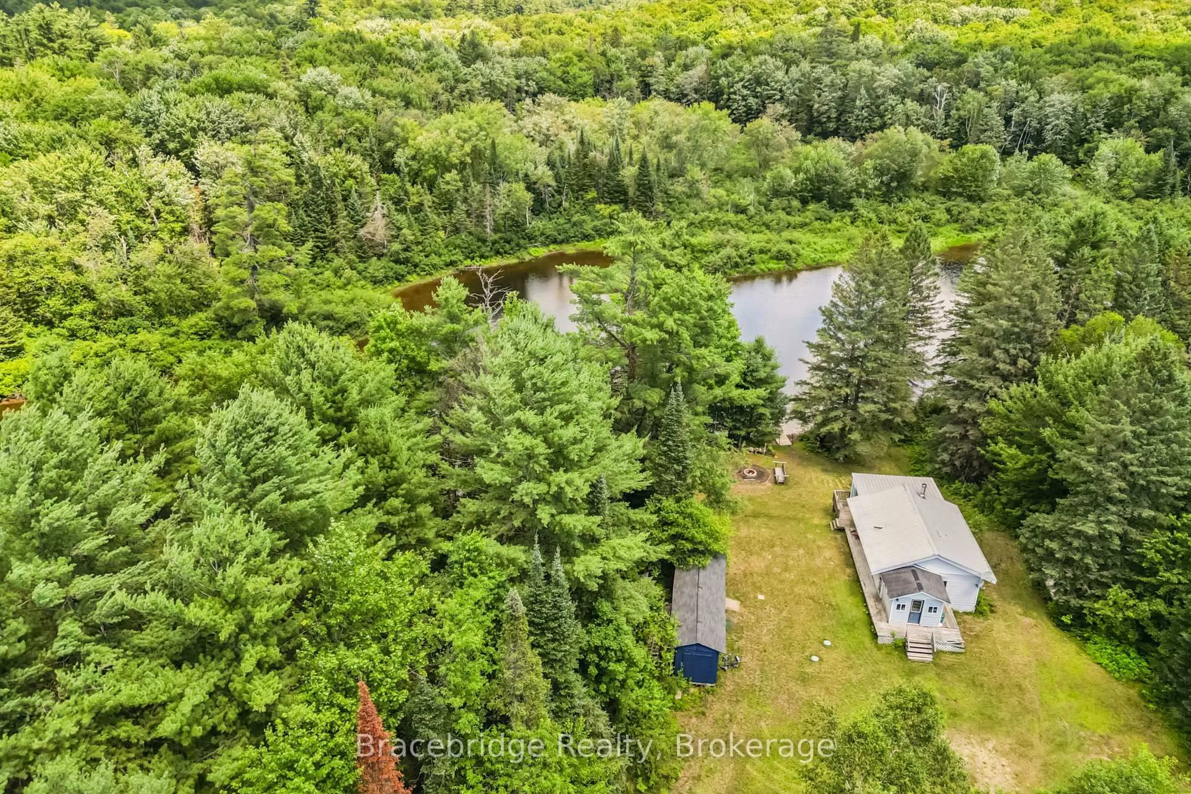 A pic from outside/outdoor area/front of a property/back of a property/a pic from drone, forest/trees view for 1100 Colony Rd, Lake of Bays Ontario P1L 1X3