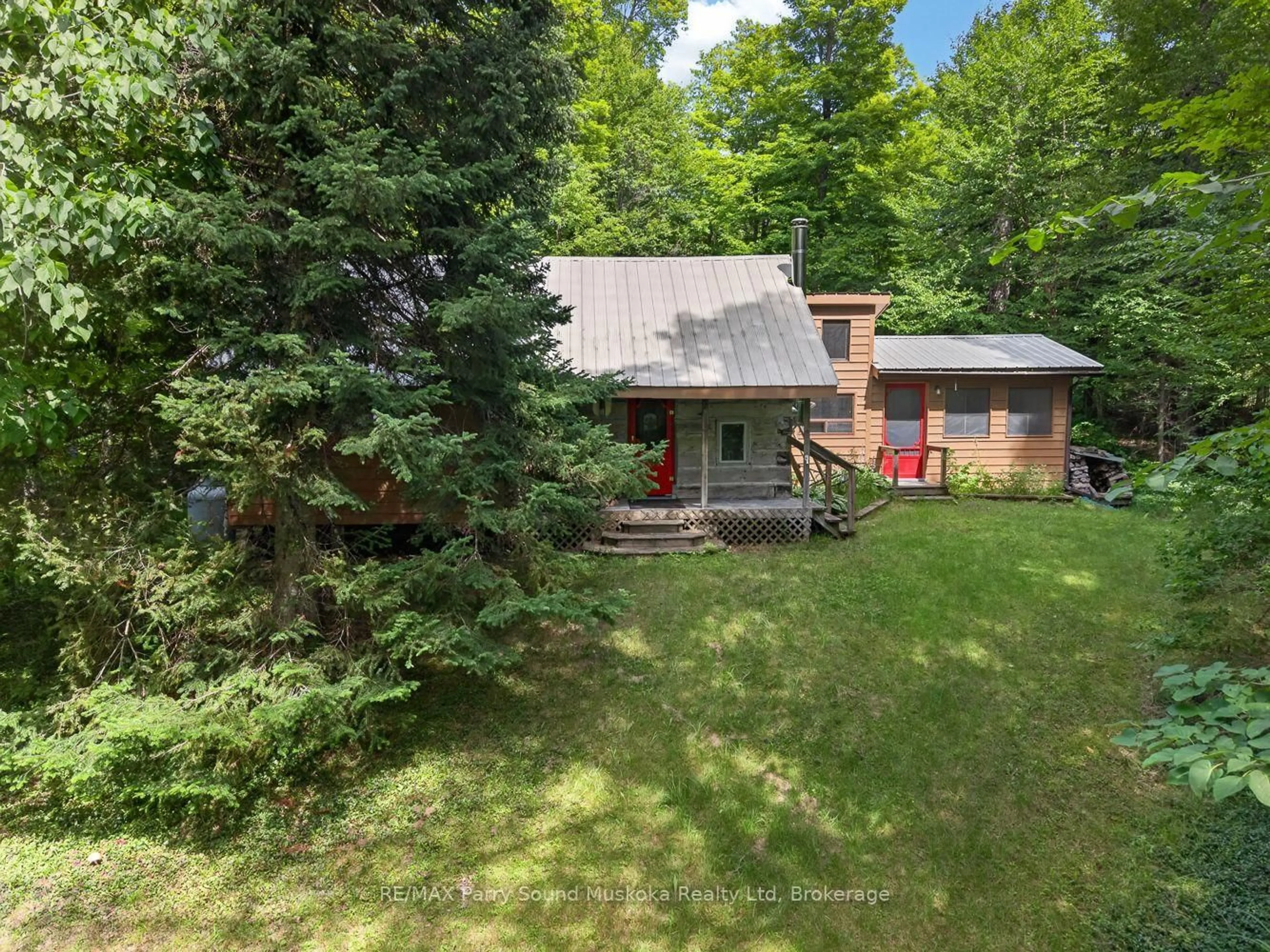 A pic from outside/outdoor area/front of a property/back of a property/a pic from drone, forest/trees view for 32 Shady Maple Tr, Whitestone Ontario P0G 1G0