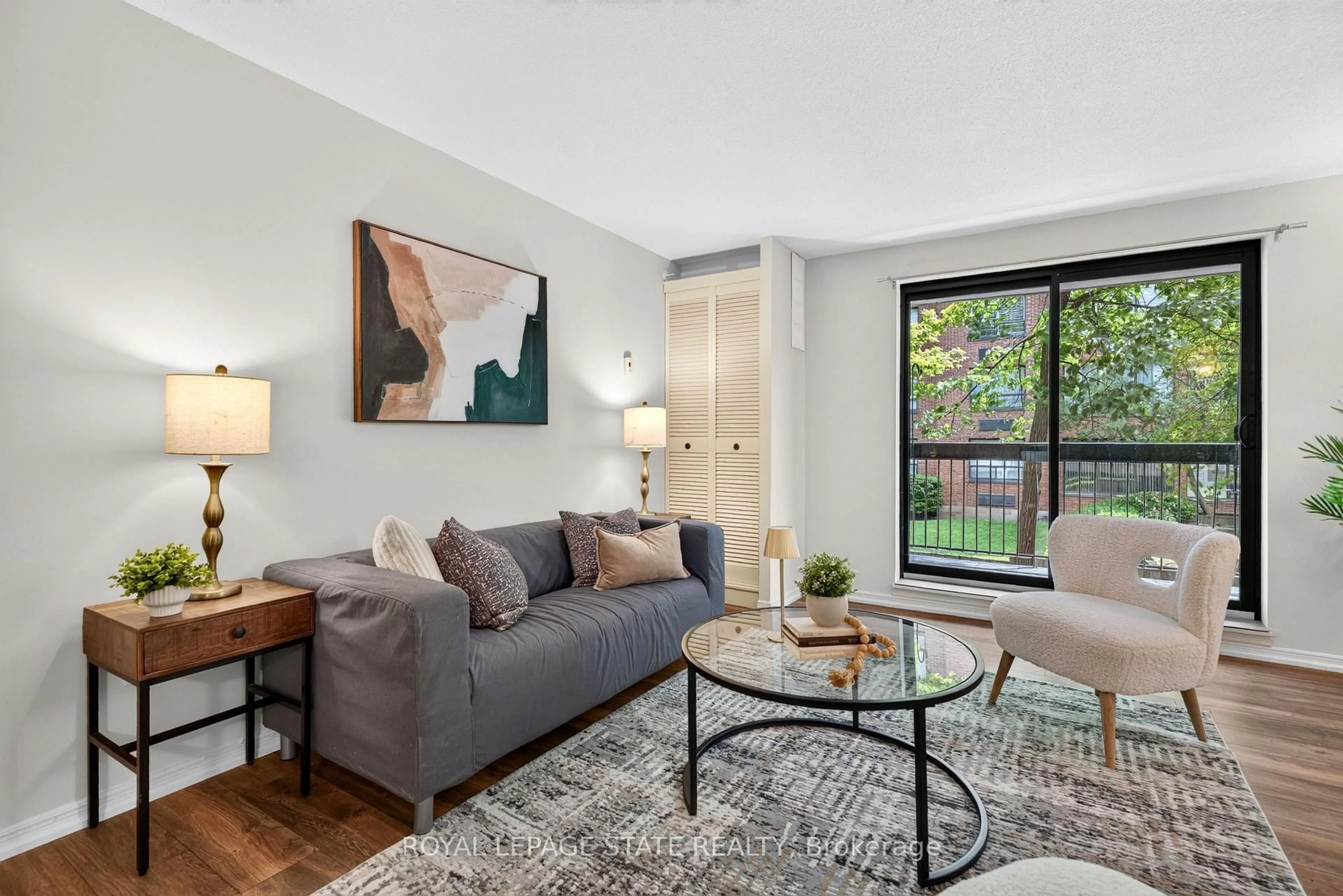 Living room with furniture, unknown for 966 Queenston Rd #203, Hamilton Ontario L8G 1B7