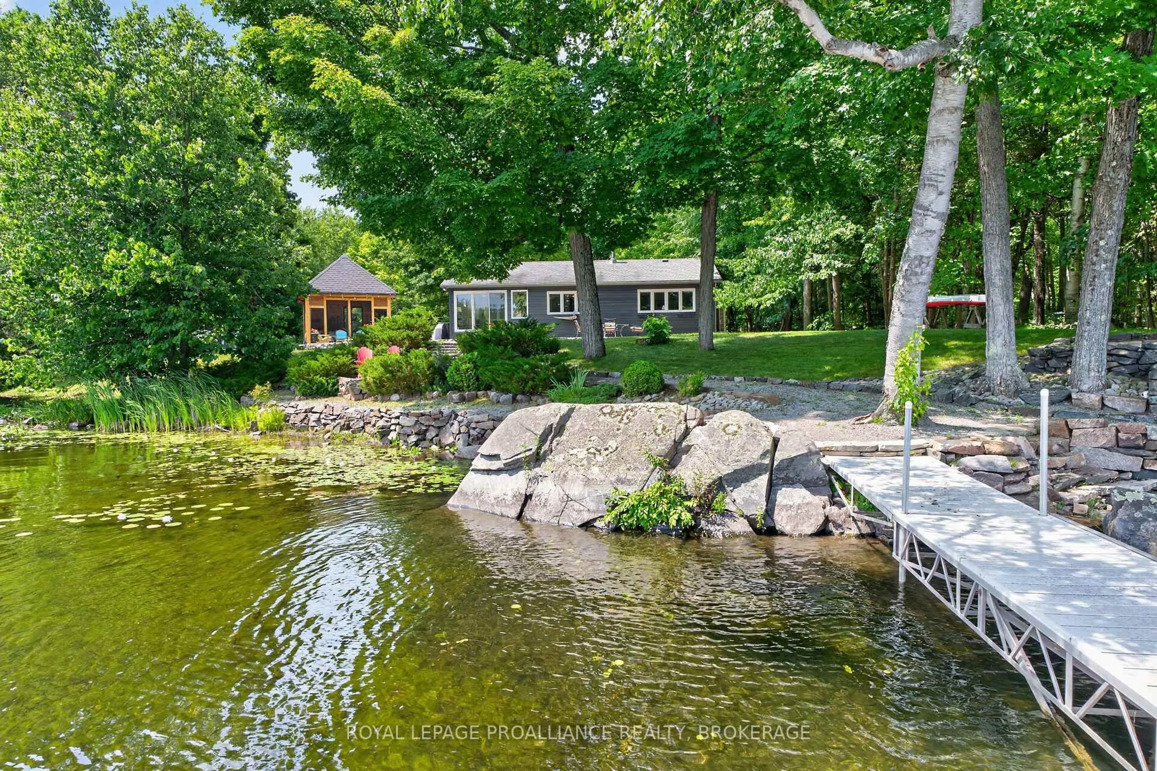 A pic from outside/outdoor area/front of a property/back of a property/a pic from drone, water/lake/river/ocean view for 1418 Wagner Rd, Sharbot Lake Ontario K0H 2P0