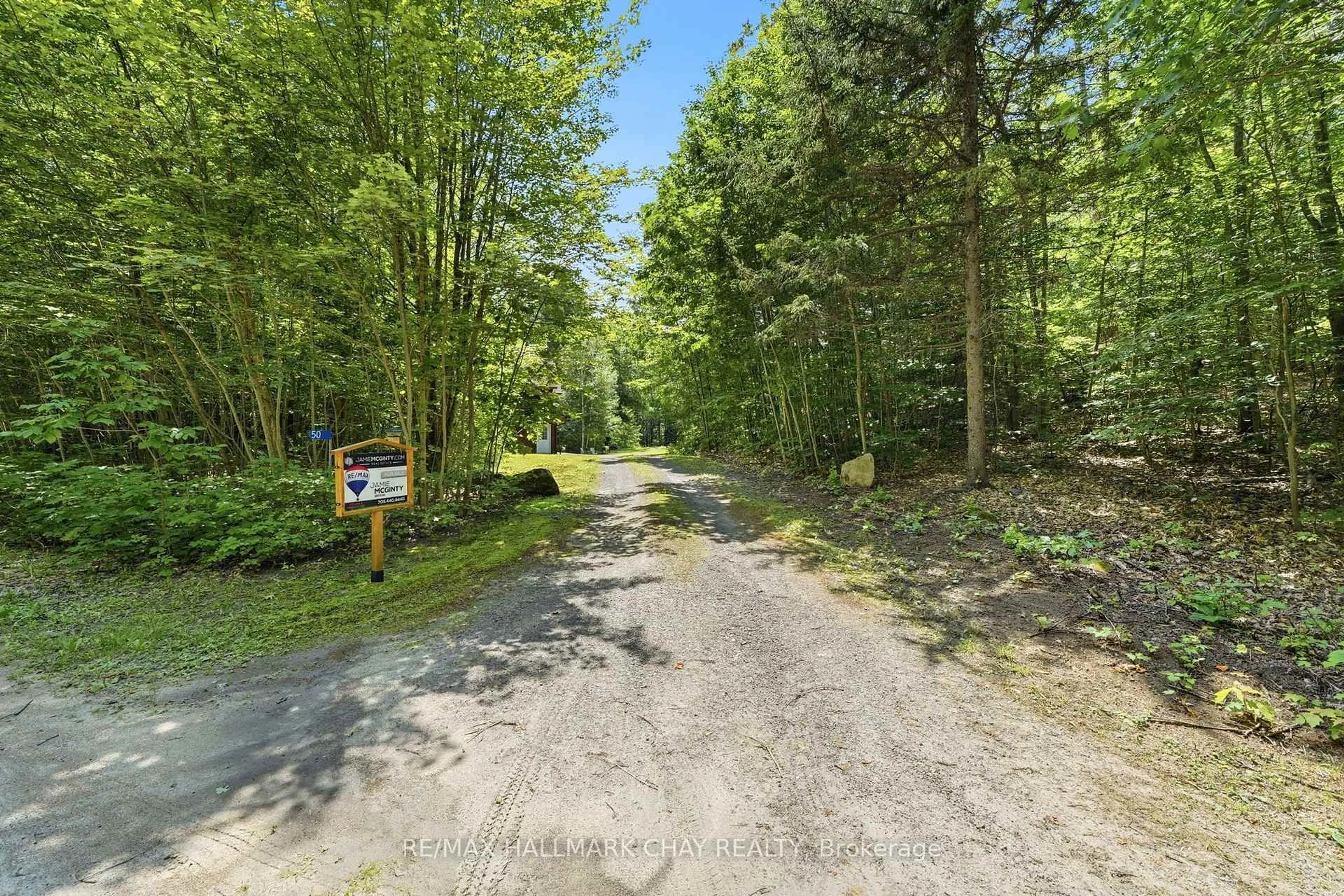 A pic from outside/outdoor area/front of a property/back of a property/a pic from drone, forest/trees view for 50 Price Point Rd, Lake of Bays Ontario P0B 1A0