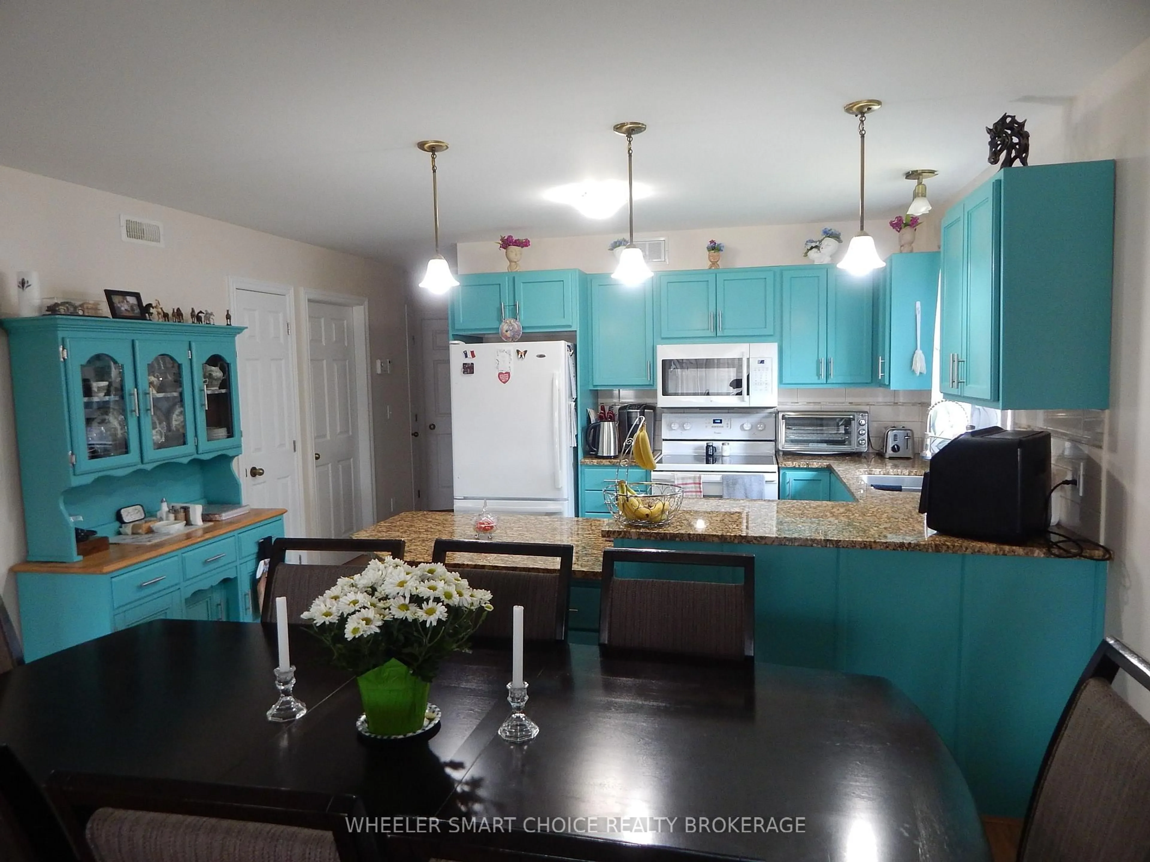 Open concept kitchen, wood/laminate floor for 13 Cypress Lane, South Stormont Ontario K0C 1M0