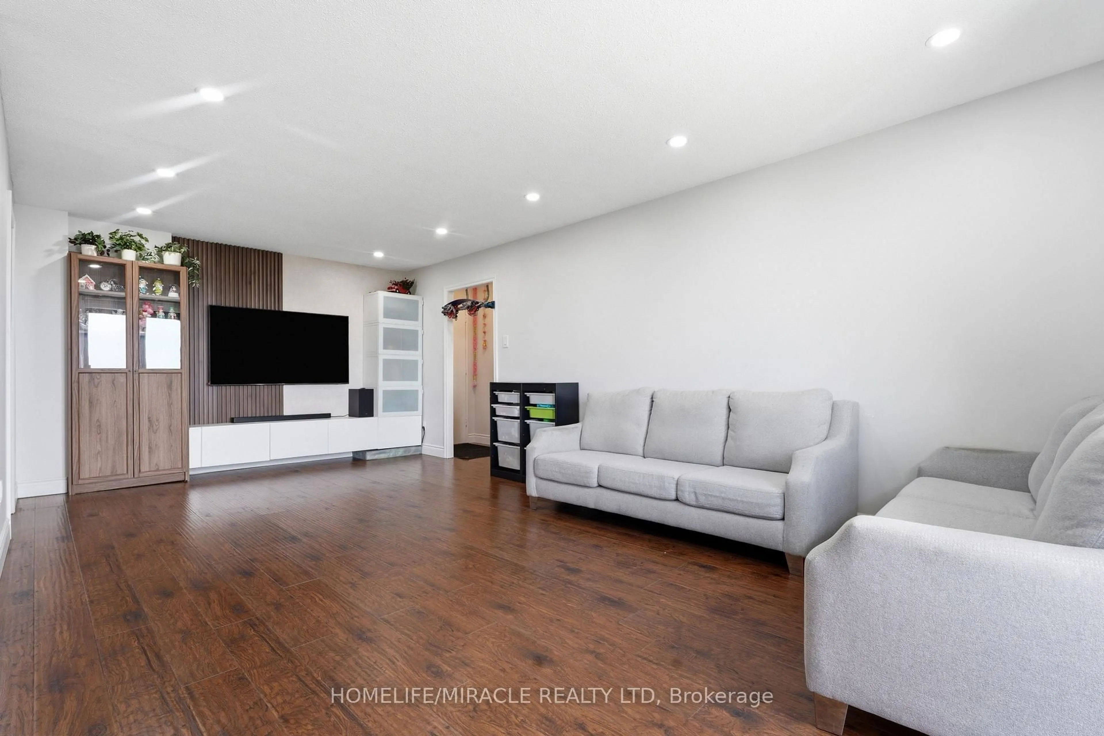 Living room with furniture, wood/laminate floor for 1100 Courtland Ave #809, Kitchener Ontario N2C 2H9