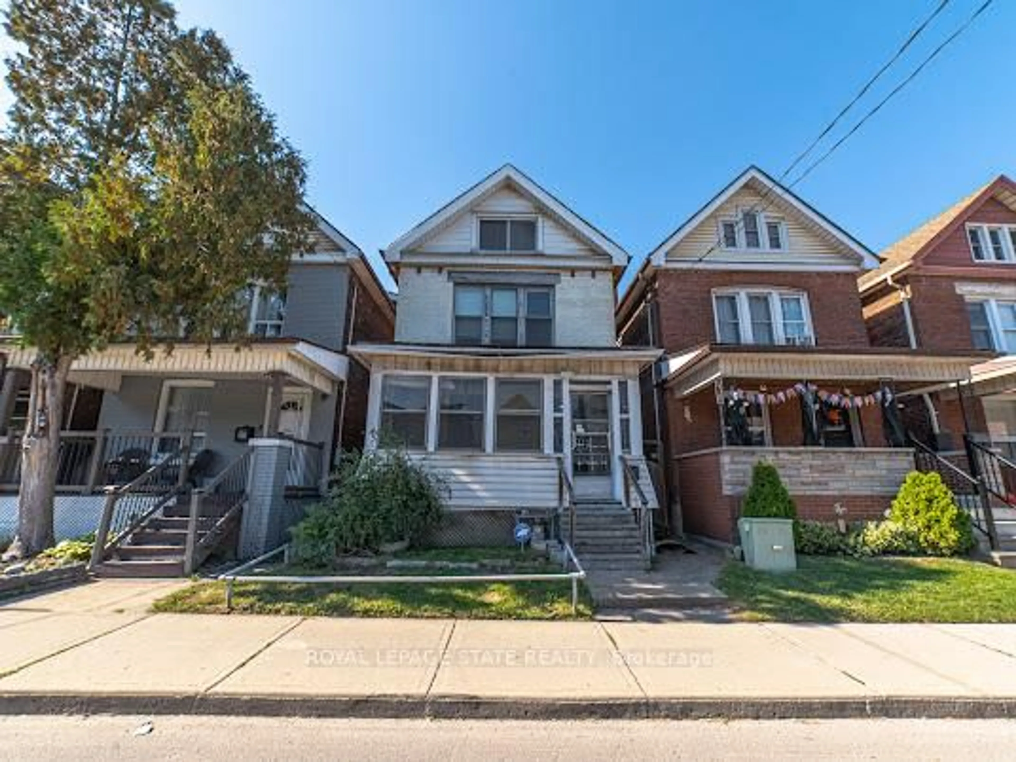 Home with brick exterior material, street for 35 Sherman Ave, Hamilton Ontario L8L 6L9