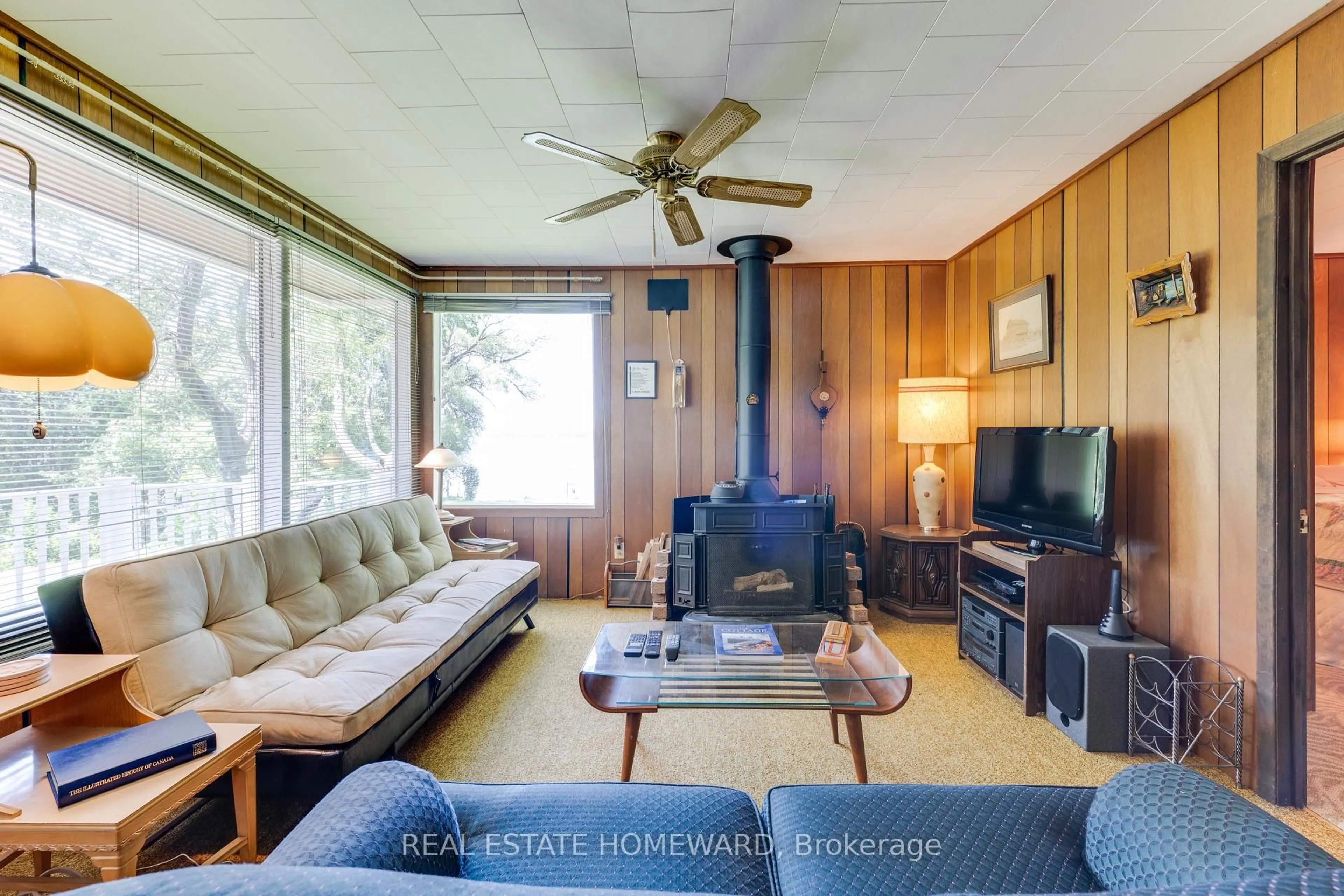 Living room with furniture, wood/laminate floor for 5248 King Rd #315, Hamilton Township Ontario K0K 2E0