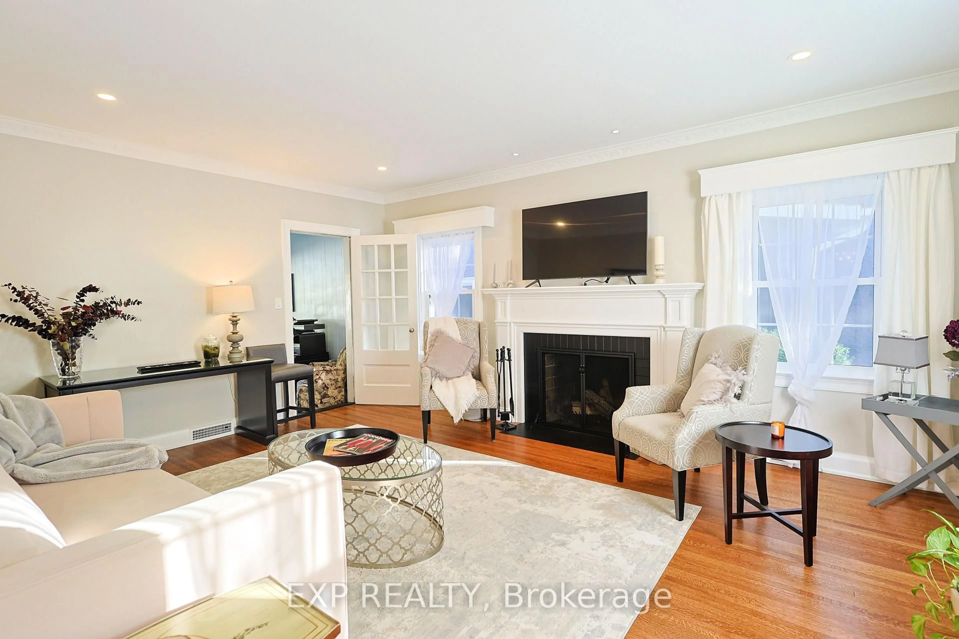 Living room with furniture, wood/laminate floor for 77 Glenridge Ave, St. Catharines Ontario L2R 4X2