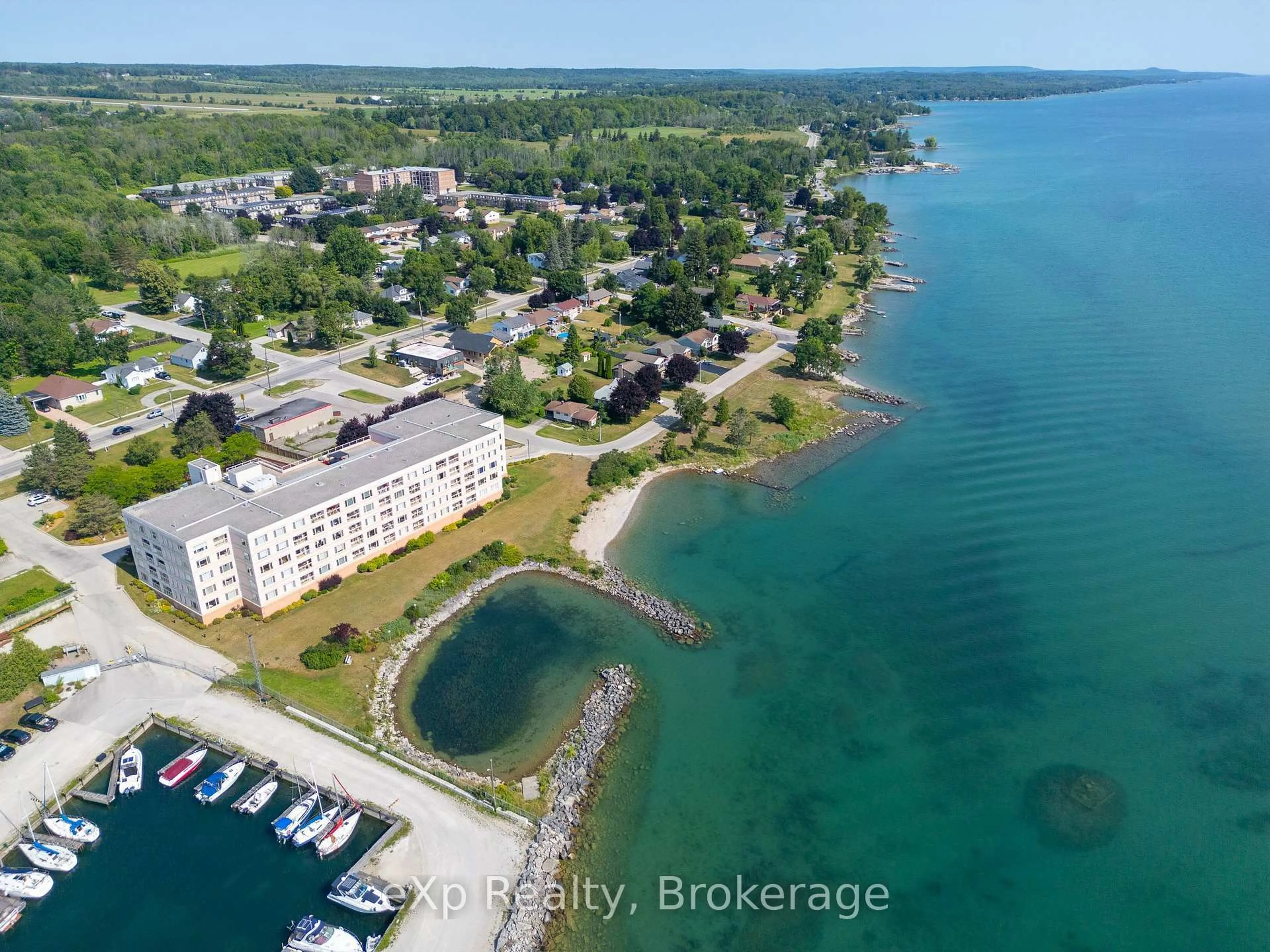 A pic from outside/outdoor area/front of a property/back of a property/a pic from drone, water/lake/river/ocean view for 2555 3rd Ave #105, Owen Sound Ontario N4K 6T8
