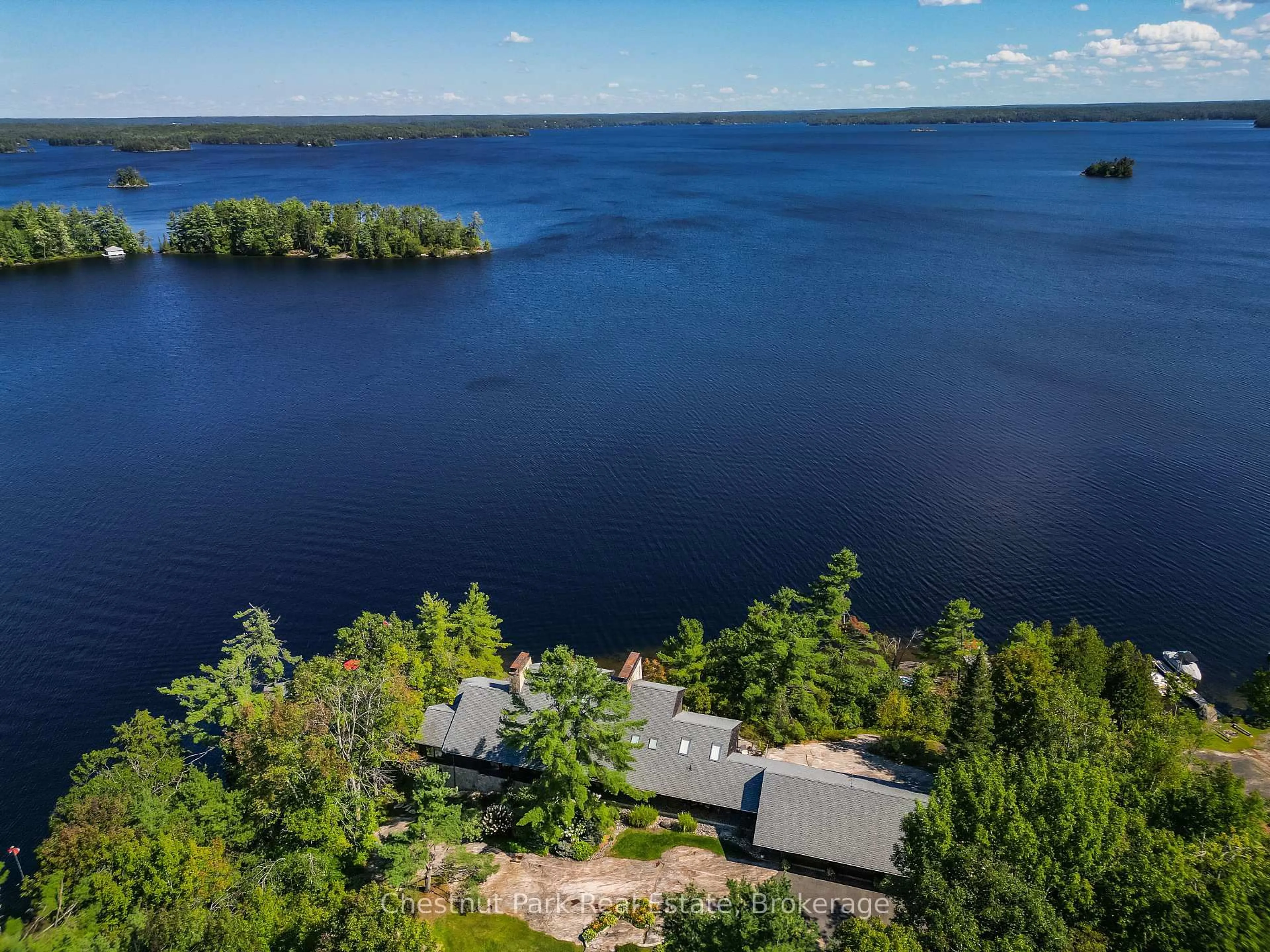 A pic from outside/outdoor area/front of a property/back of a property/a pic from drone, water/lake/river/ocean view for 1088 Lawland Heights Rd #2, Gravenhurst Ontario P1P 1R2