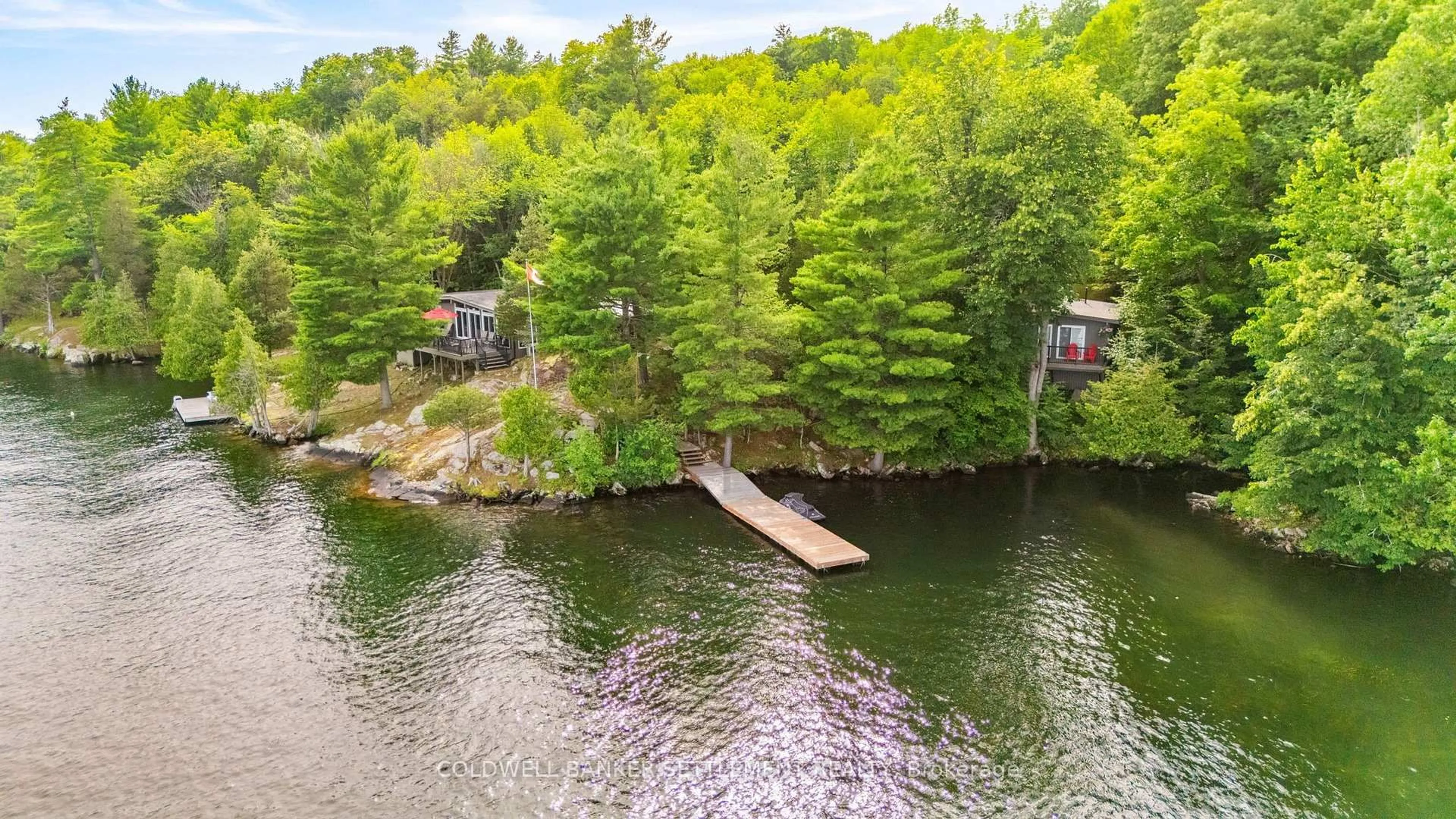A pic from outside/outdoor area/front of a property/back of a property/a pic from drone, water/lake/river/ocean view for 100 Abby Hawk Lane, Perth Ontario K7H 3C5