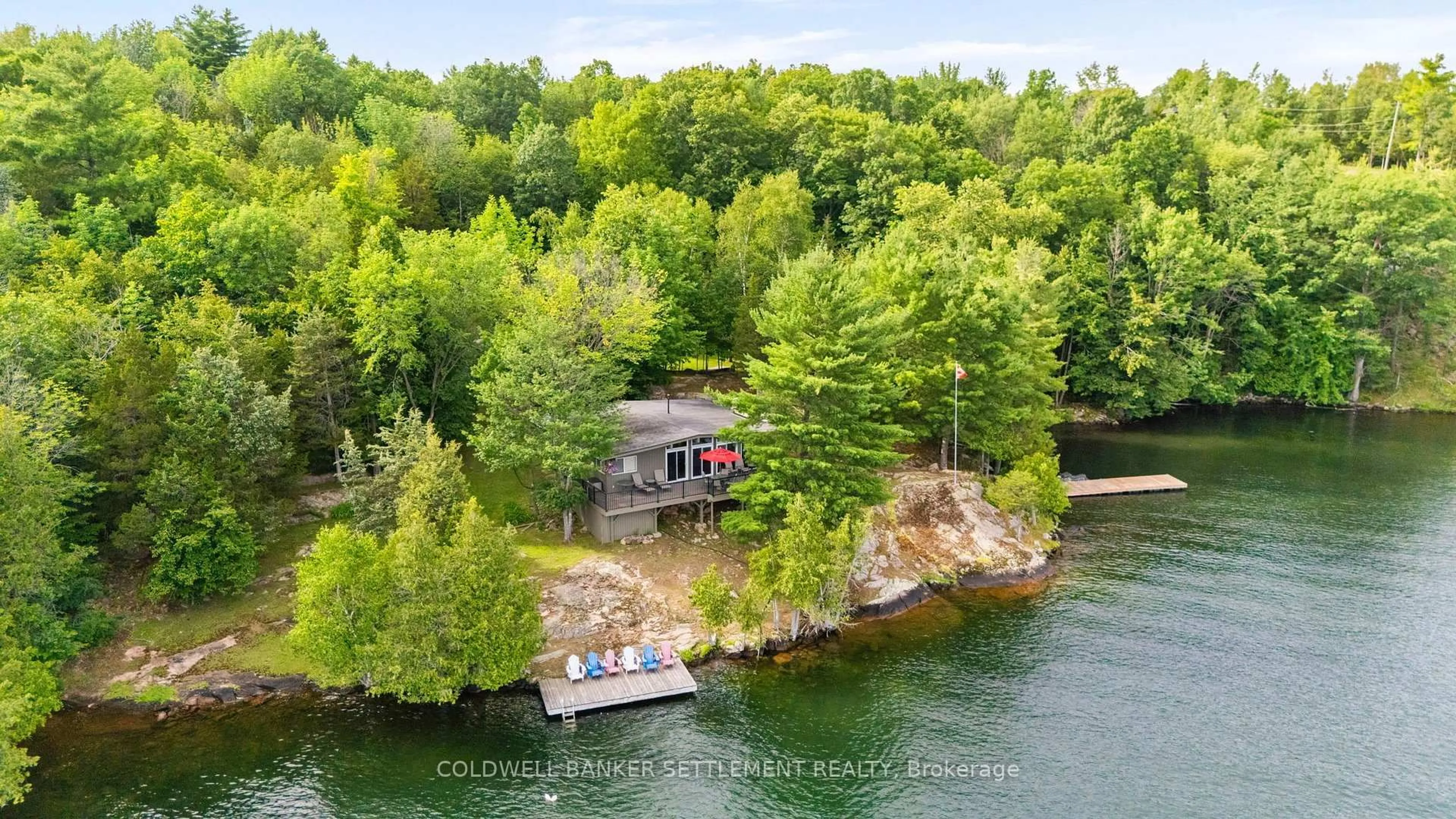 A pic from outside/outdoor area/front of a property/back of a property/a pic from drone, water/lake/river/ocean view for 100 Abby Hawk Lane, Perth Ontario K7H 3C5