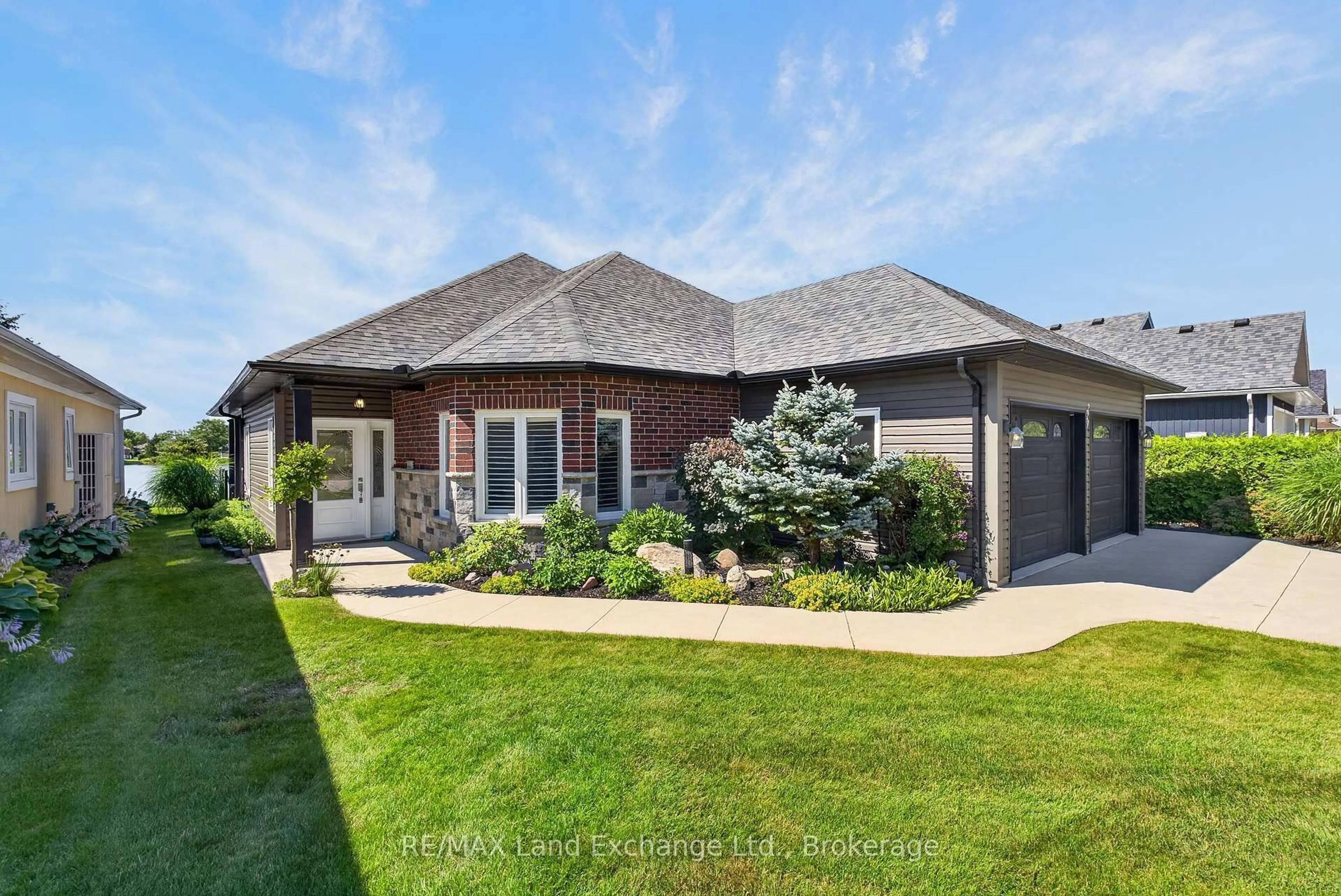 Home with brick exterior material, street for 229 Carloway Tr, Huron-Kinloss Ontario N2Z 0A4