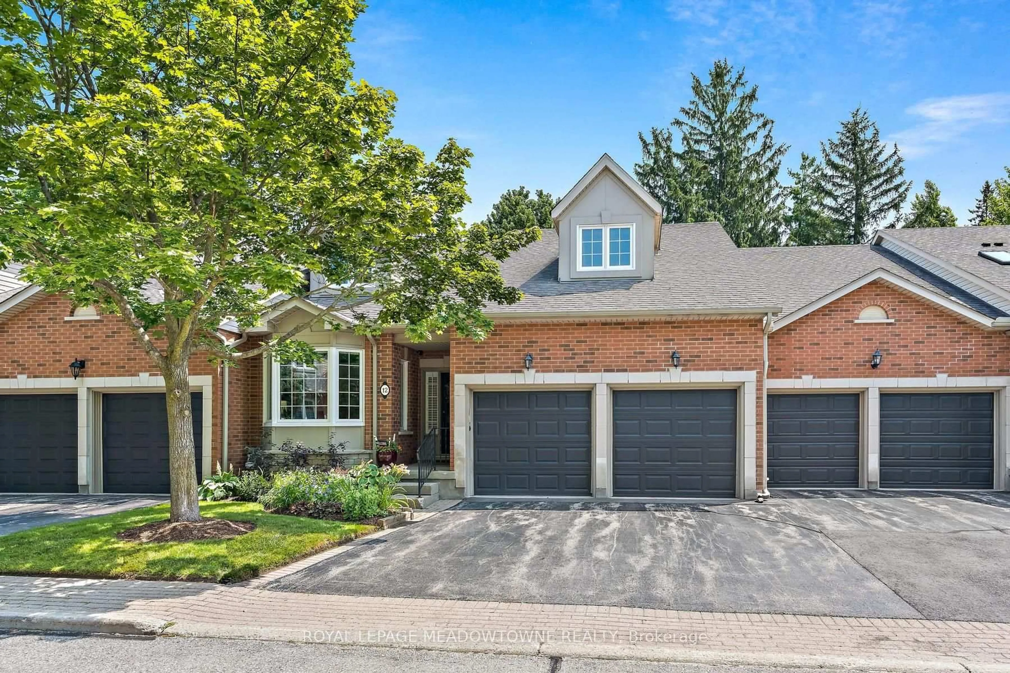 Home with brick exterior material, street for 12 Fairway Lane, Guelph Ontario N1E 7A9
