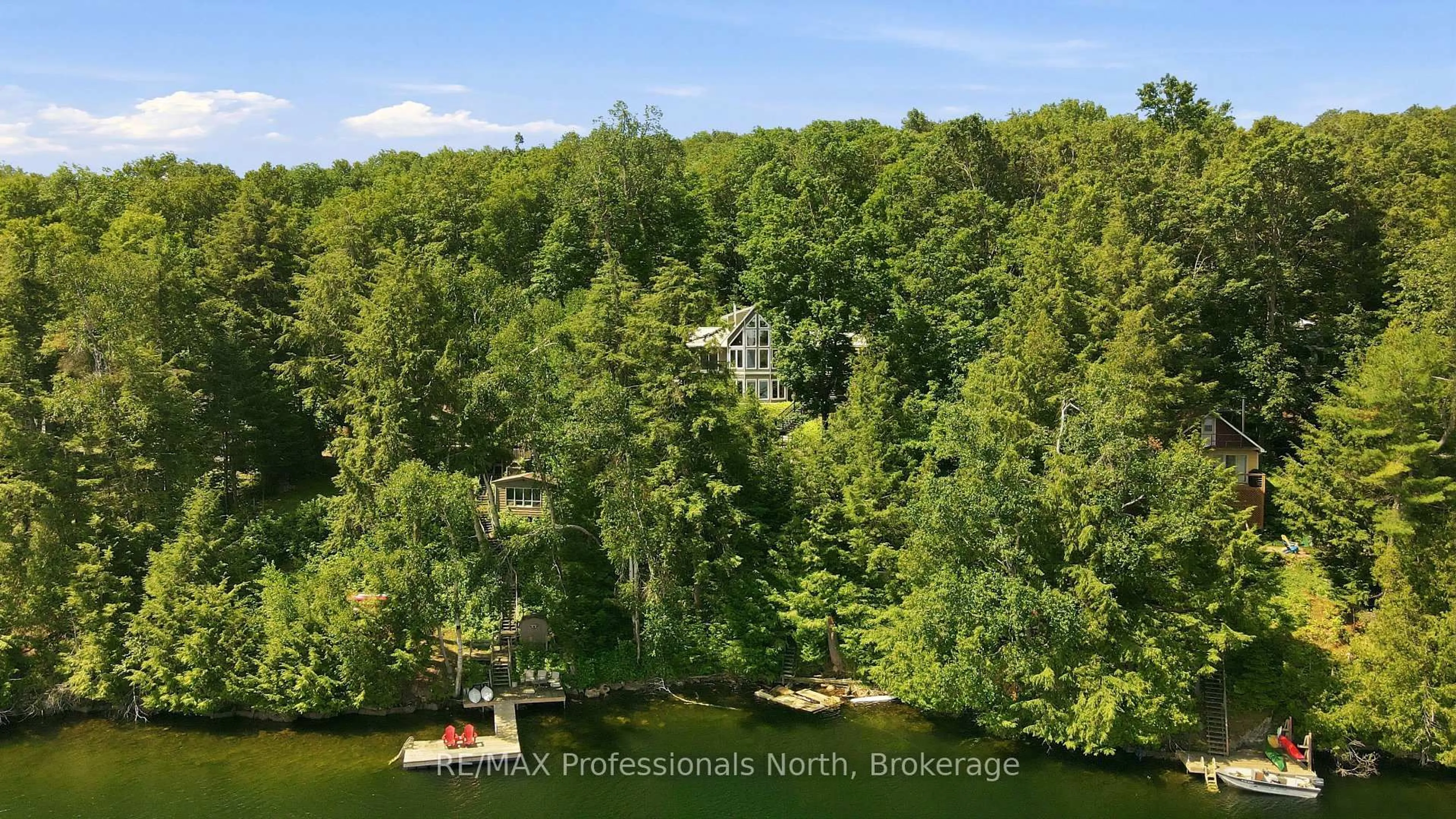 A pic from outside/outdoor area/front of a property/back of a property/a pic from drone, water/lake/river/ocean view for 1114 Miskwabi Lake Rd, Dysart et al Ontario K0M 1S0
