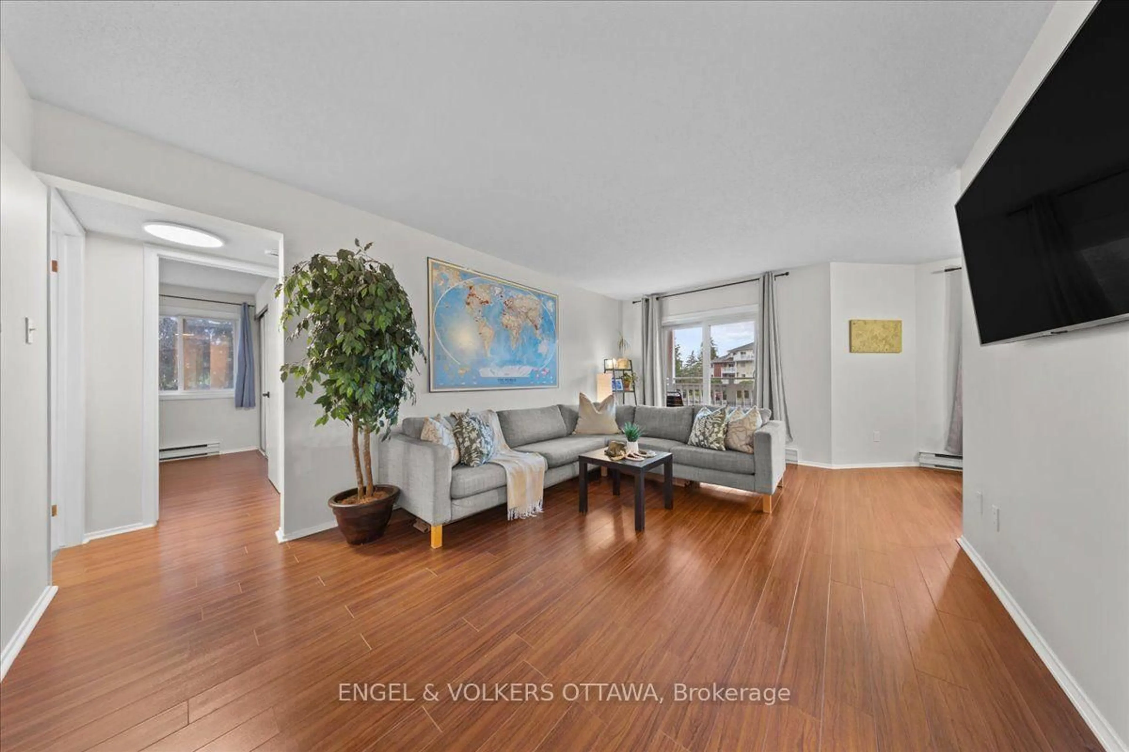 Living room with furniture, unknown for 268 Lorry Greenberg Dr #107, Ottawa Ontario K1T 3K1