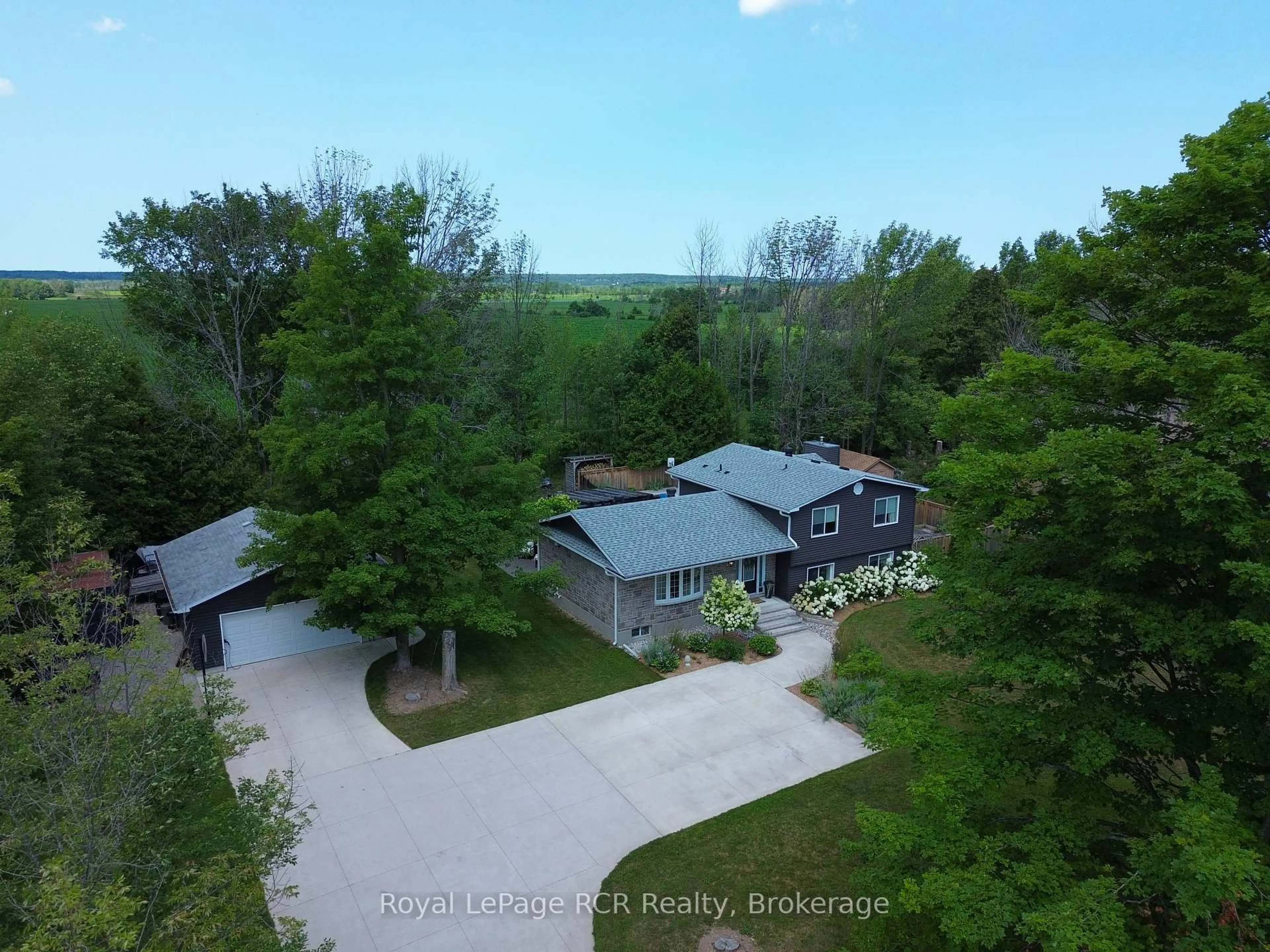 A pic from outside/outdoor area/front of a property/back of a property/a pic from drone, unknown for 319370 Grey Road 1 Rd, Georgian Bluffs Ontario N0H 1S0