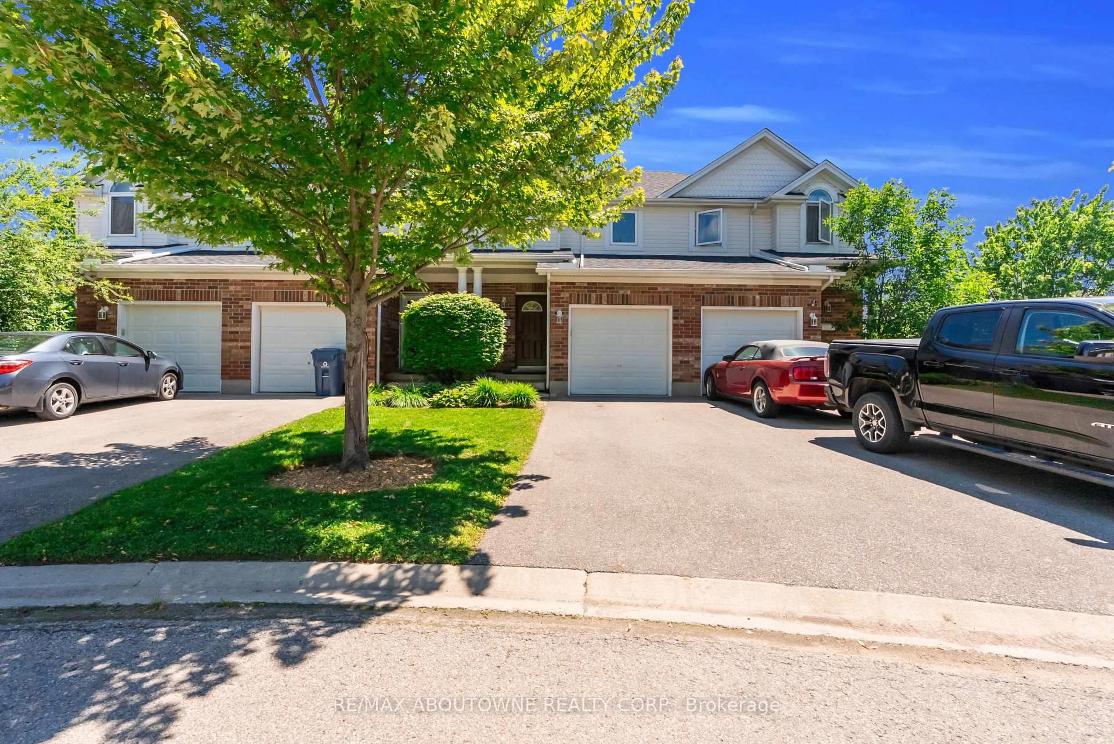 A pic from outside/outdoor area/front of a property/back of a property/a pic from drone, street for 151 Clairfields Dr #15, Guelph Ontario N1L 1P5