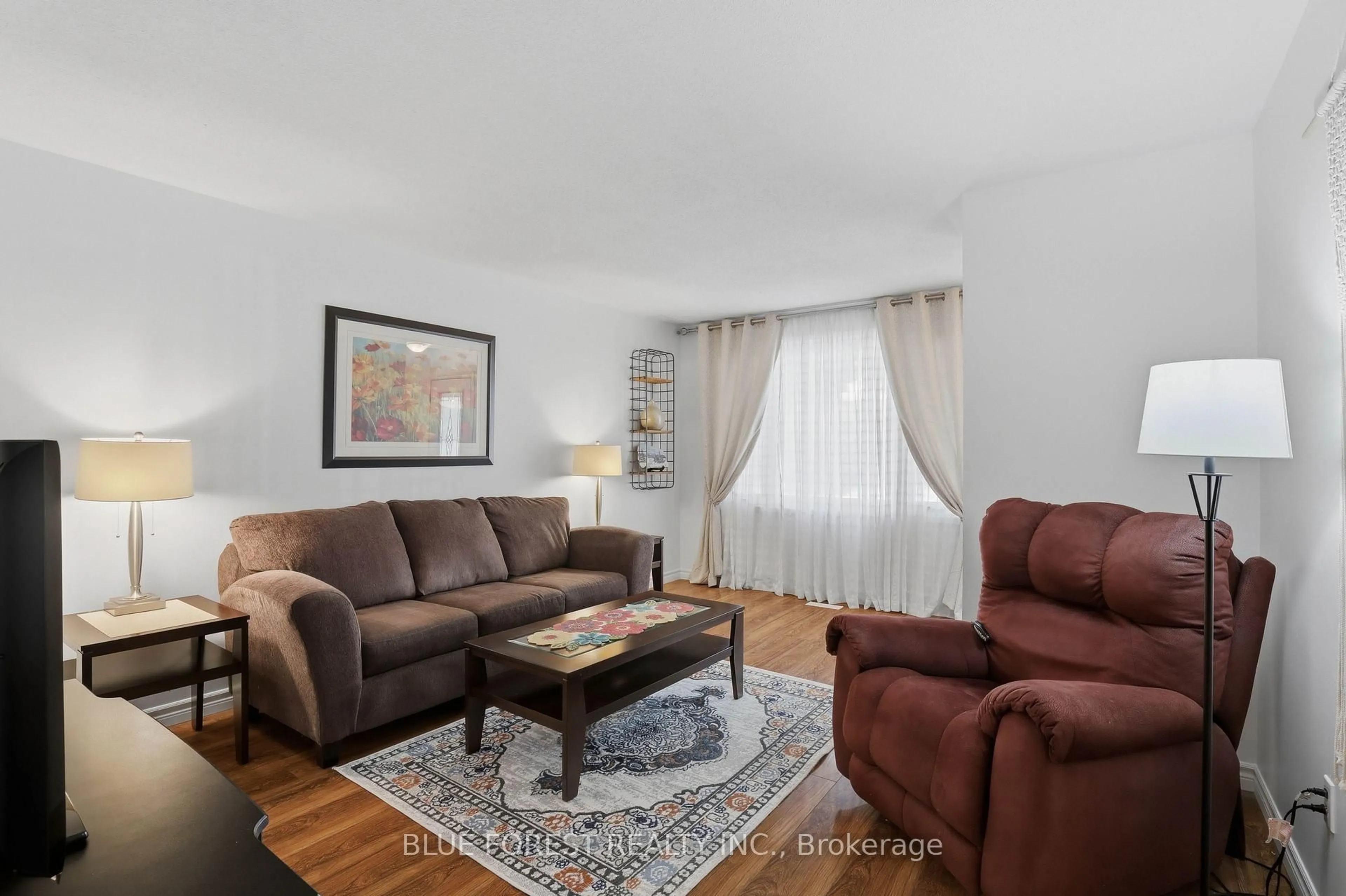 Living room with furniture, wood/laminate floor for 93 Nicholas Cres, London South Ontario N6E 2E8