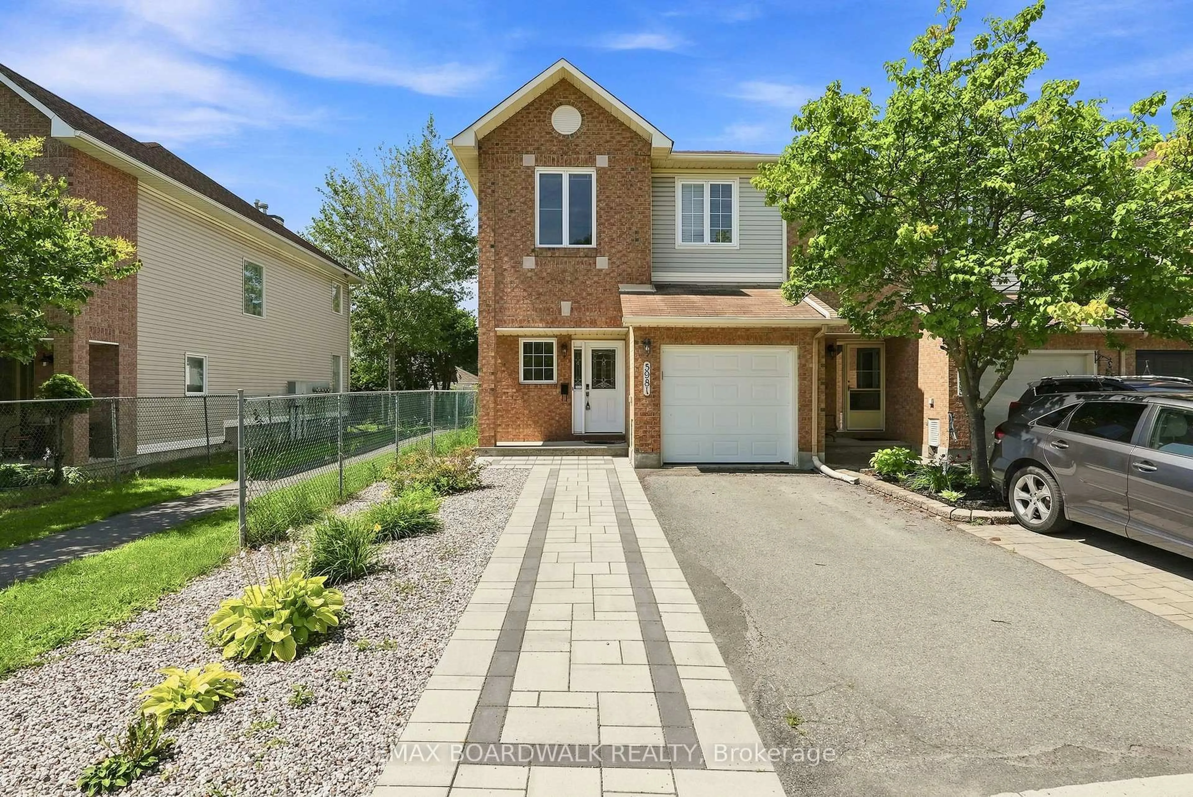 Home with brick exterior material, street for 5981 Pineglade Cres, Ottawa Ontario K1W 1G7