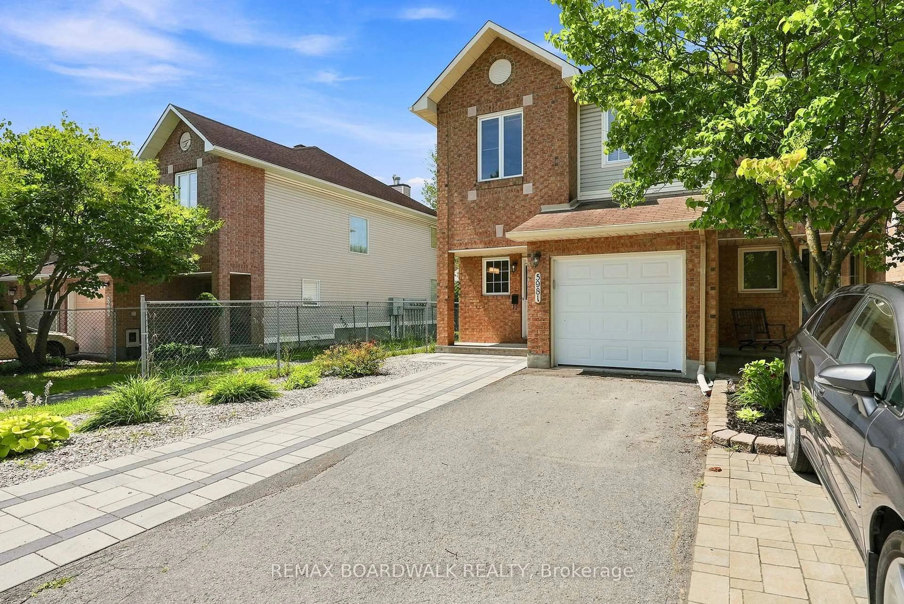 Home with brick exterior material, street for 5981 Pineglade Cres, Ottawa Ontario K1W 1G7