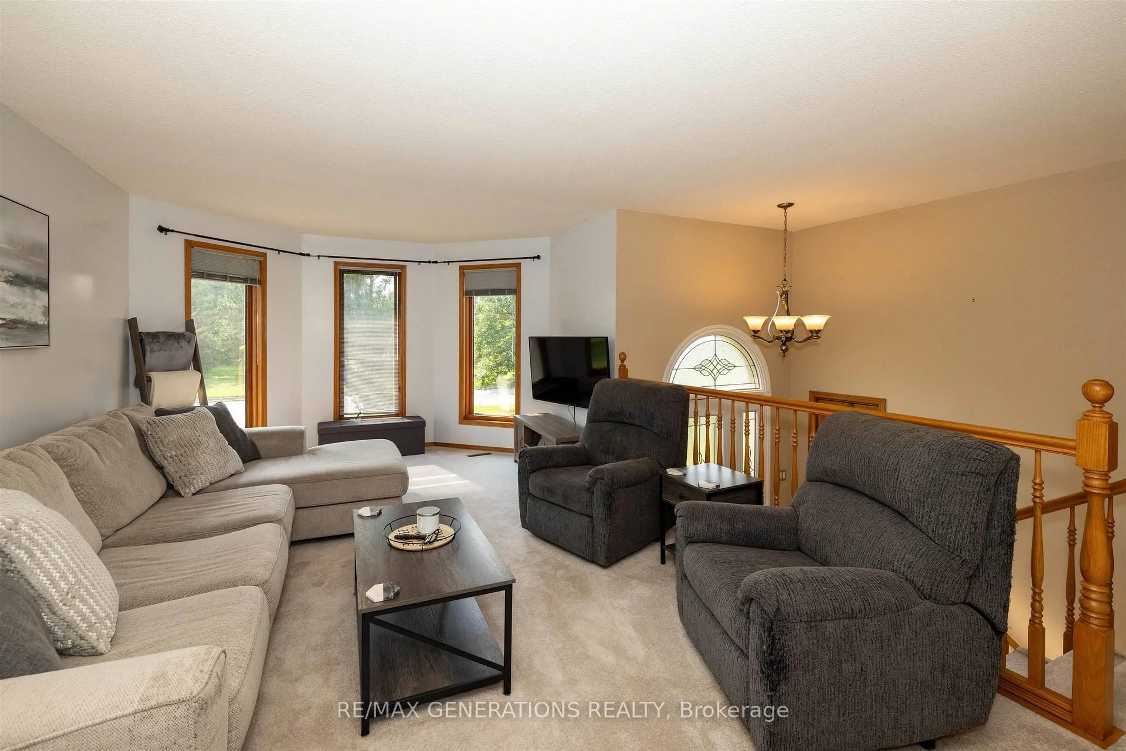 Living room with furniture, wood/laminate floor for 2446 Caspian St, Thunder Bay Ontario P7J 1A1