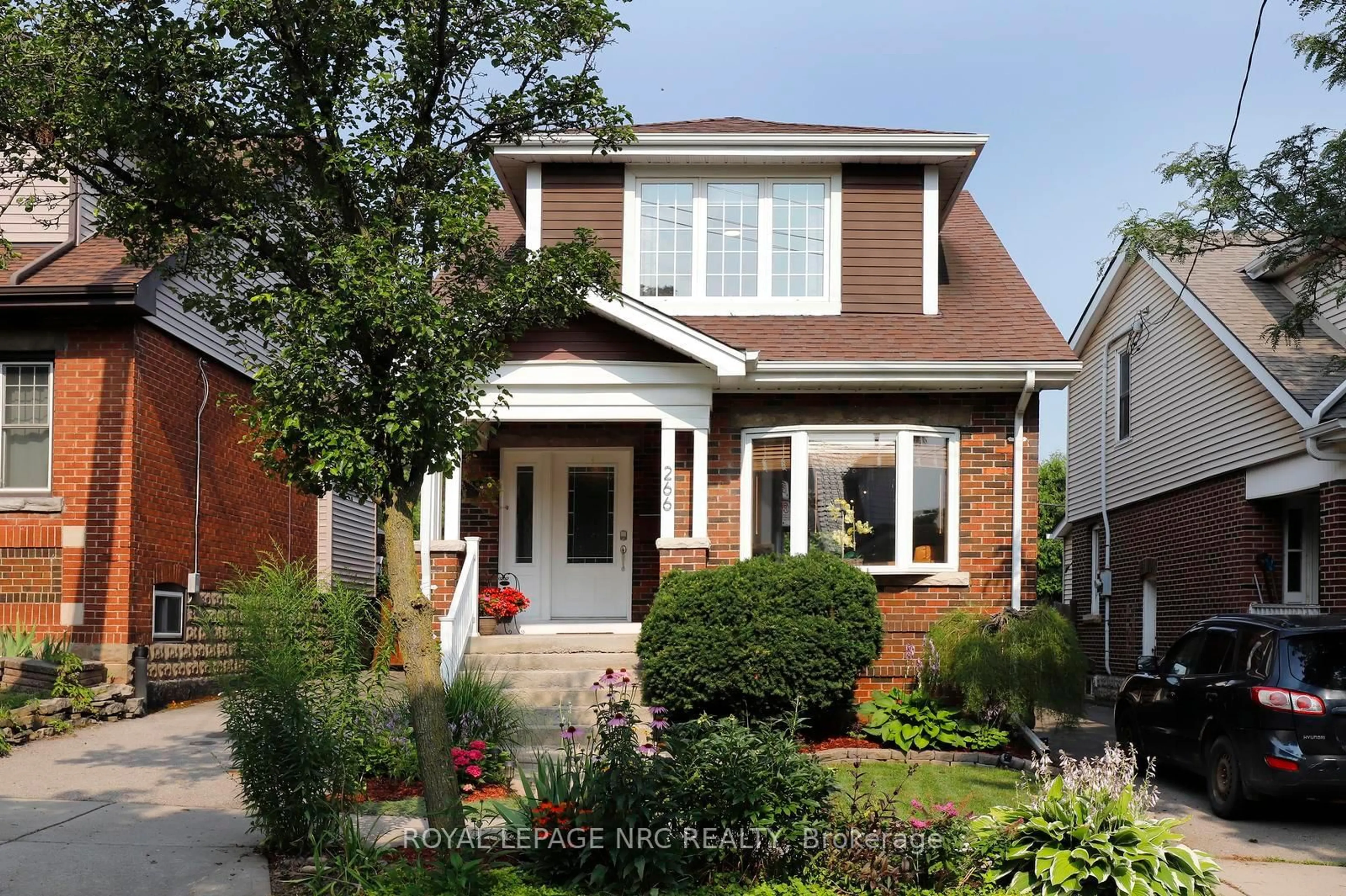Home with brick exterior material, street for 266 London St, Hamilton Ontario L8K 2H2